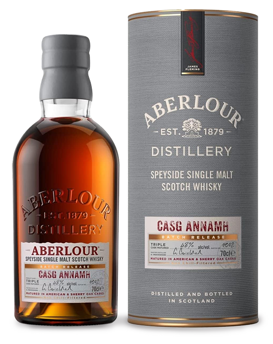 Bottle of Aberlour Casg Annamh single malt Scotch whisky next to its cylindrical packaging