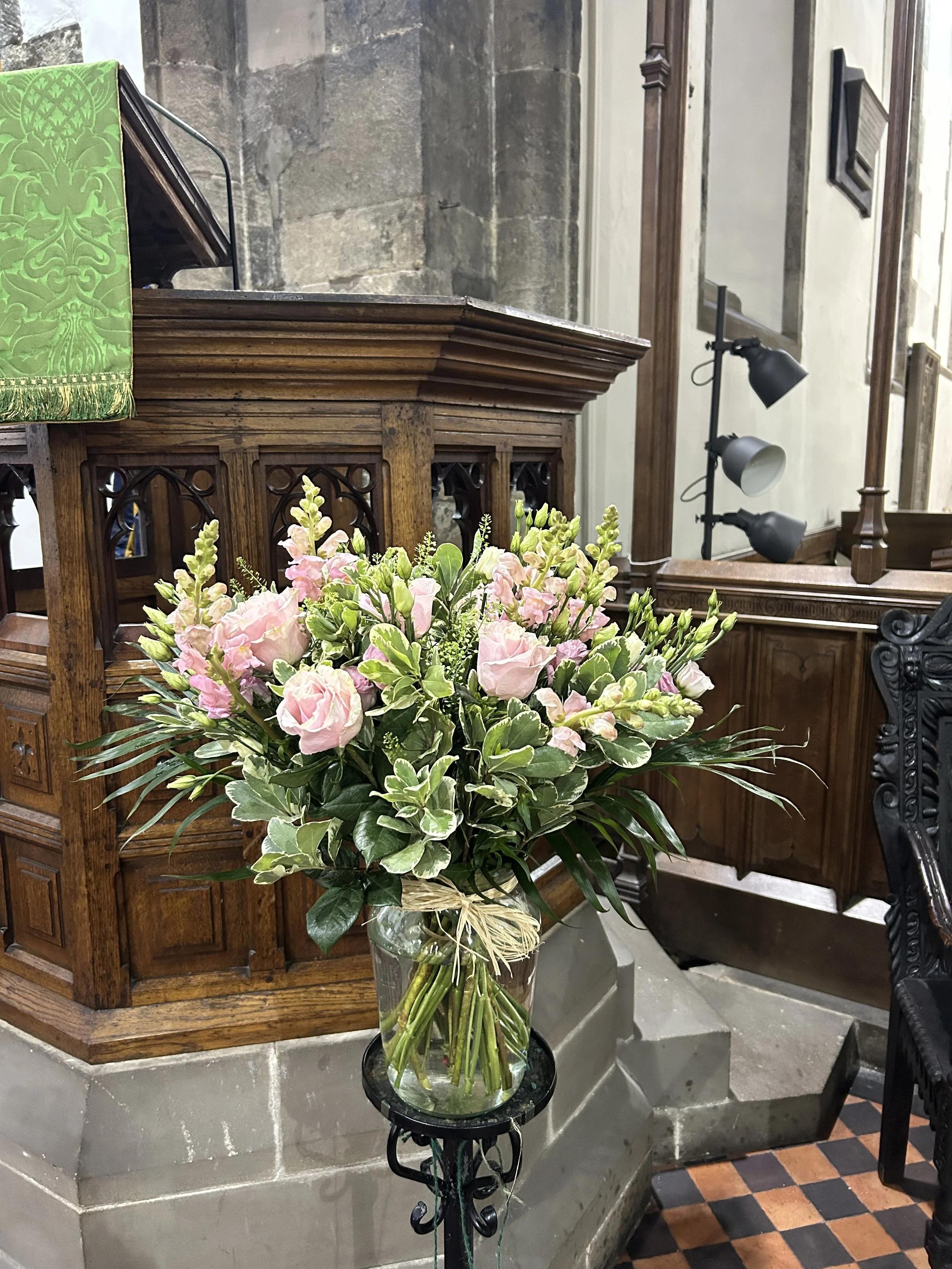 A large bouquet of pink flowers for a funeral