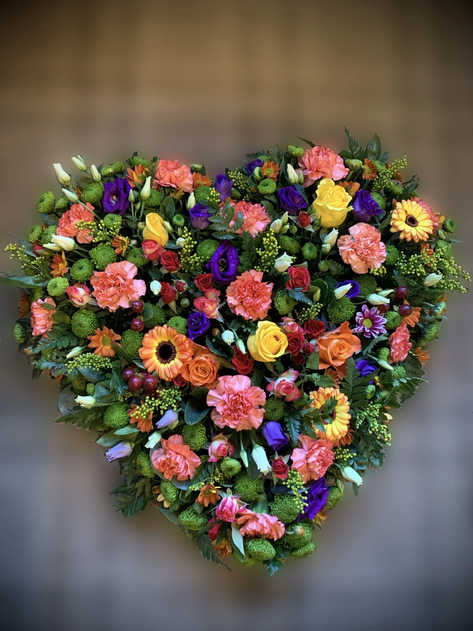 Heart-shaped floral arrangement made by Annie's Flower Shed.
