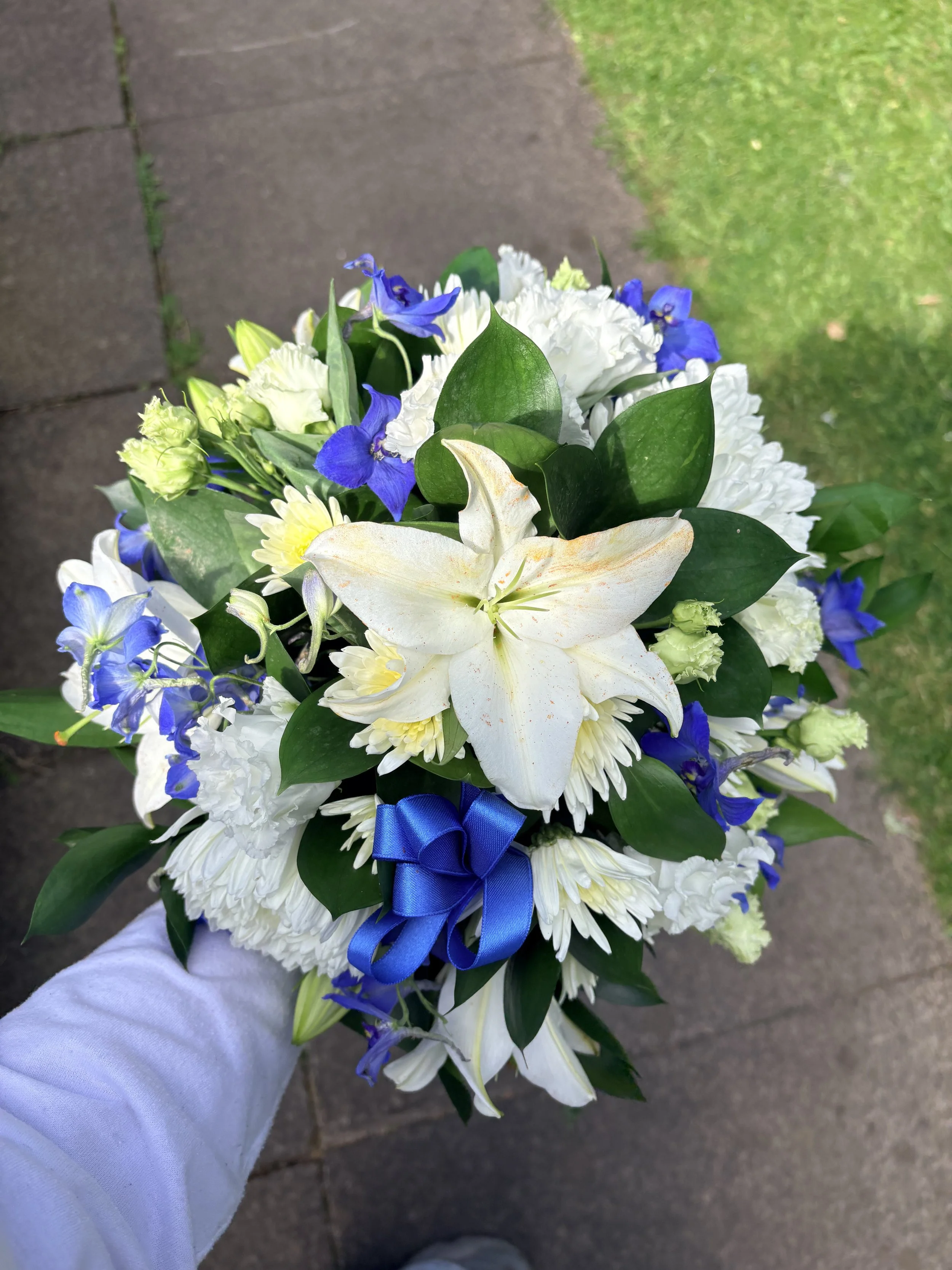 blue and white funeral arrangement