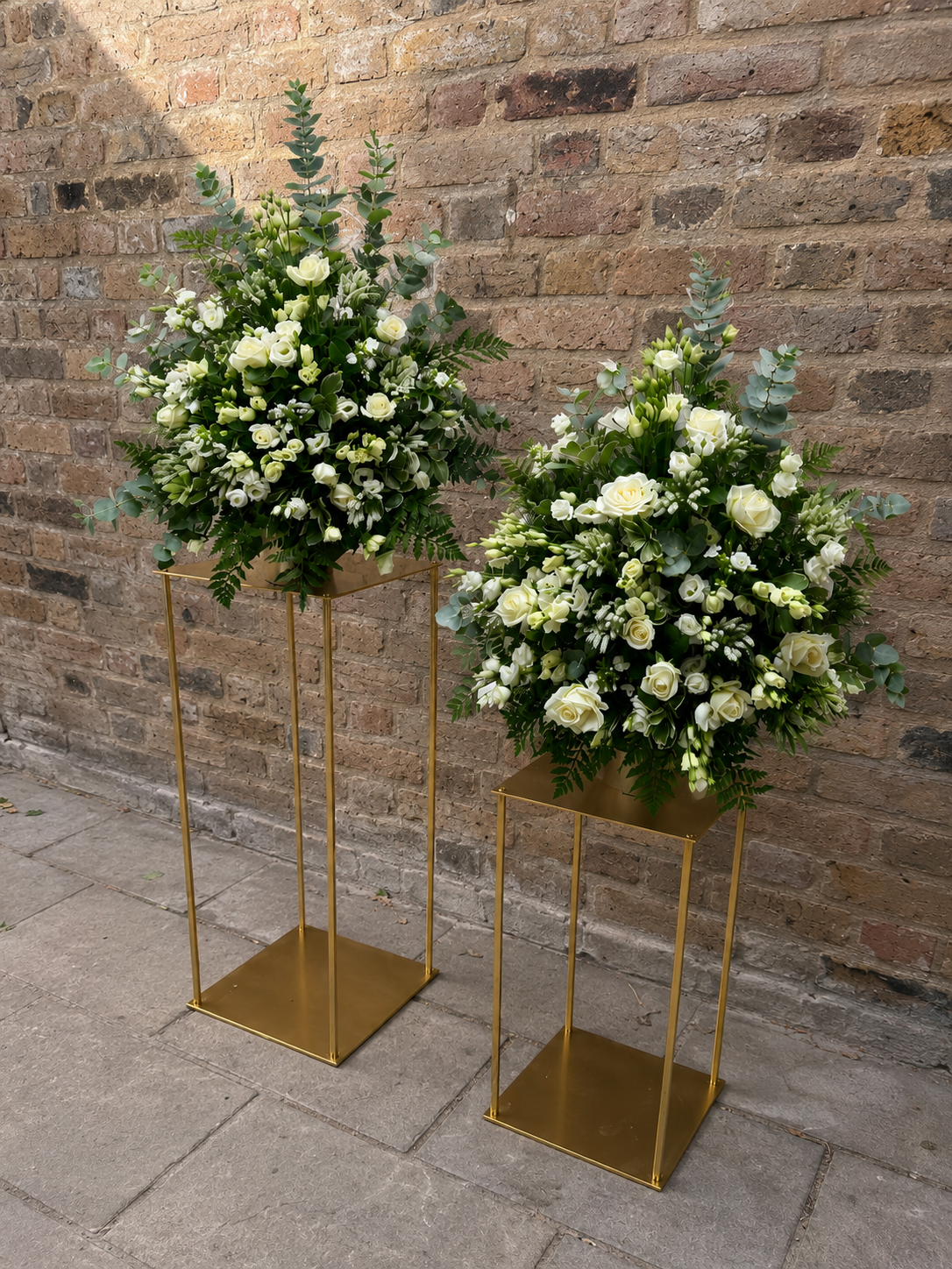 Two tall wedding arrangements.