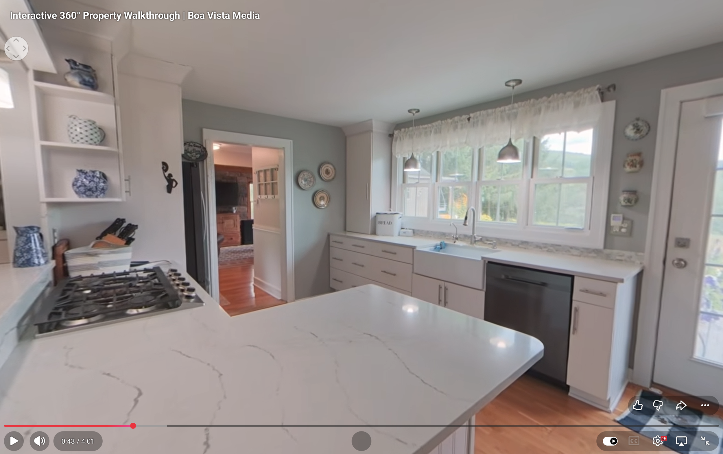Interactive 360 - degree property walkthrough showing a bright modern kitchen, an example of immersive real estate video services by Boa Vista Media.