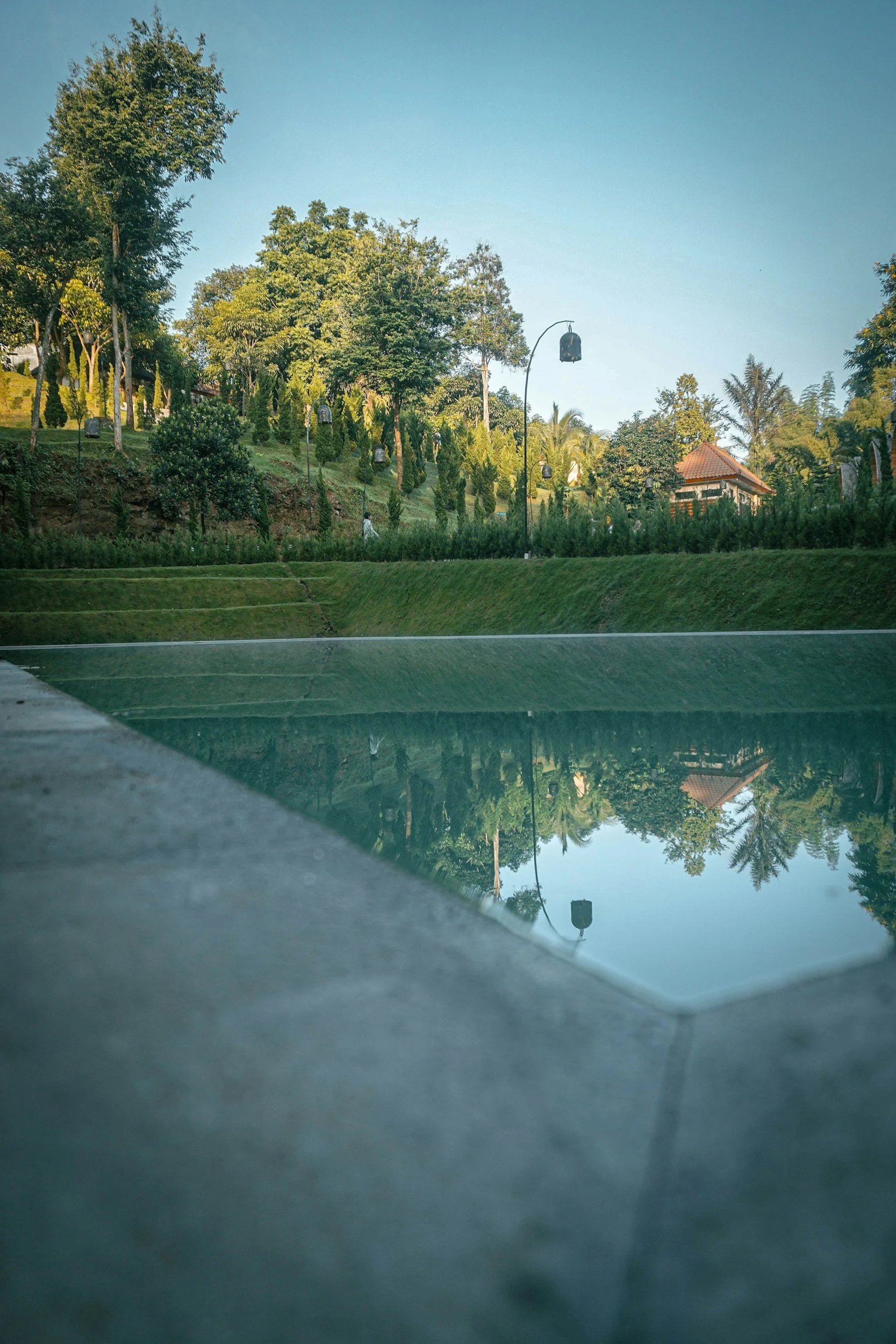 Natural pool and green landscape setting.