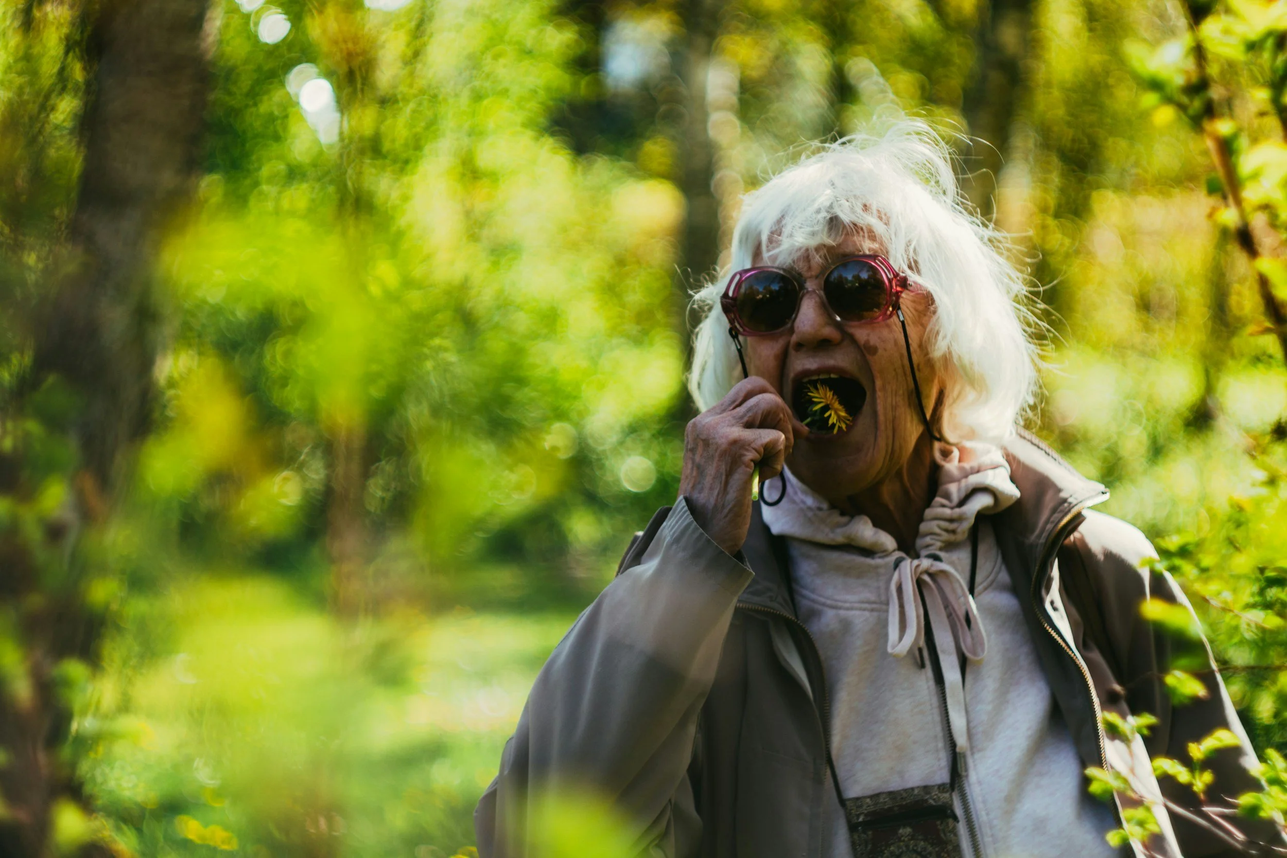 Older Women eating on hike. 