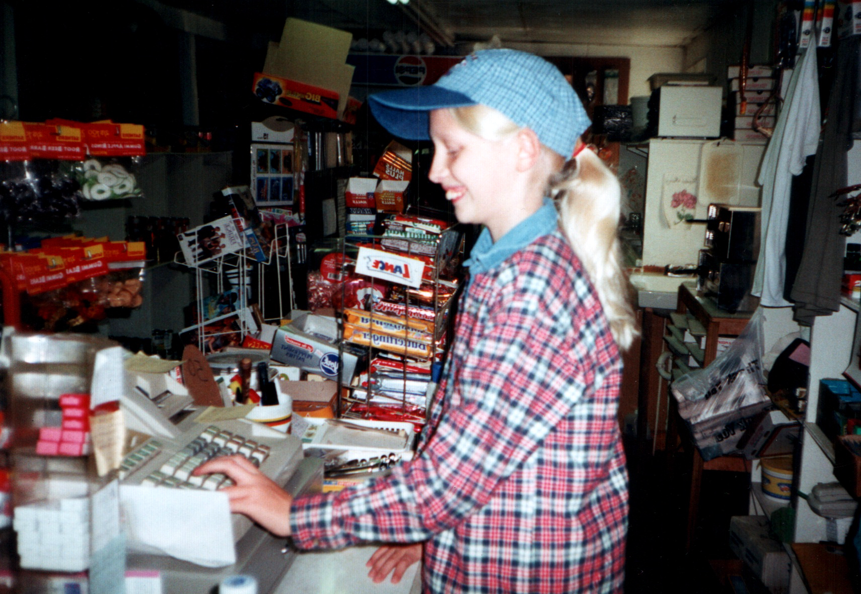 Current proprietor Megan (Epperson) Falce running the register in the year 2000.  