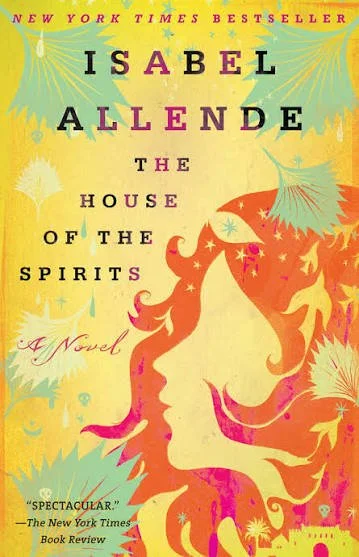The book cover for Isabelle Allende's House of Spirits: the cover is yellow with an artist impression of a woman's face in profile in a deep orange with deep pink hi-lights. There are artistic impressions of leaves, stars and birds.