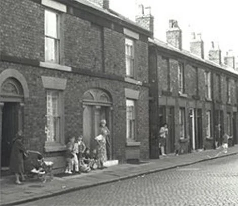 Black and white photo of a street of terraced houses in Everton, approx 1920s.