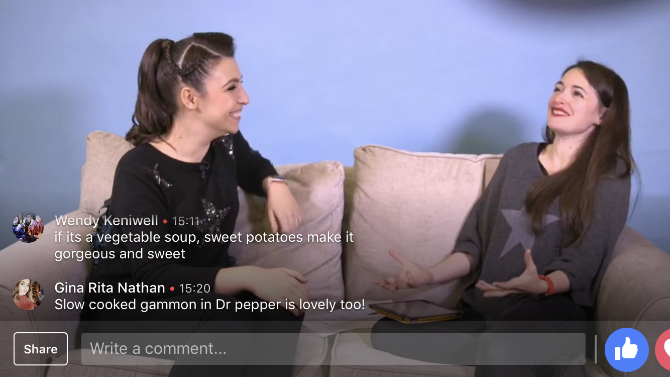 A still from a Facebook Live in 2018 that Amie was hosting for Mumsnet; she's interview Emily Leary (a who is smiling broadly as Amie is gesturing, smiling and mid-saying something. There are comments from viewers talking about their favourite meals.