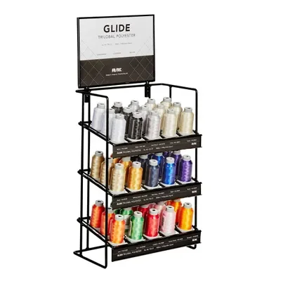 Display stand with various spools of multicolored polyester thread.