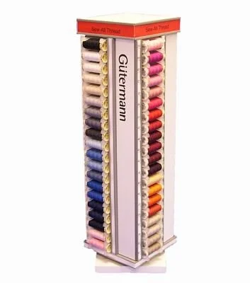 Display stand with multiple colorful spools of thread arranged vertically.