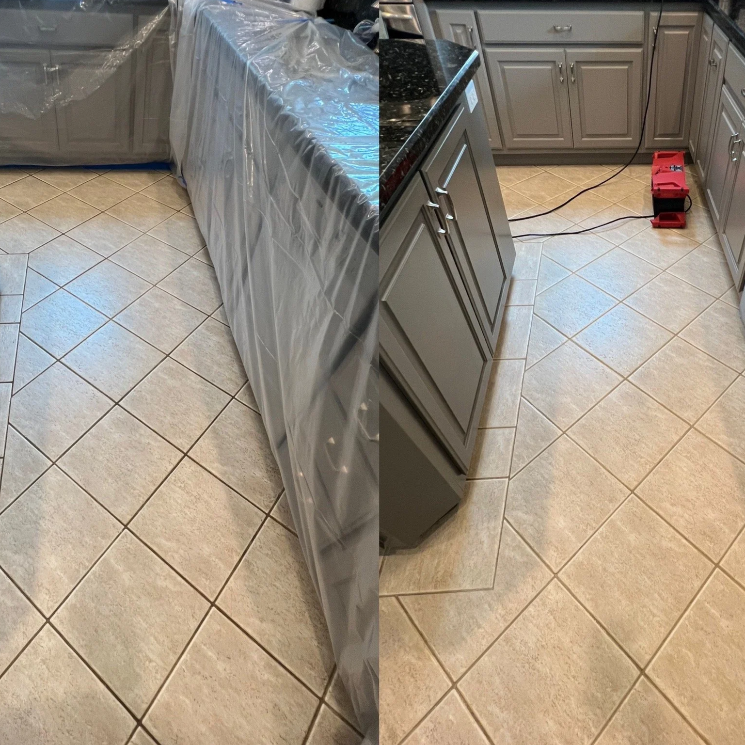 A split view of a kitchen before and after cabinet painting. The left side shows grey cabinets covered in plastic for painting, while the right side reveals the same cabinets freshly painted in a solid grey color. The kitchen has beige tiled flooring and black granite countertops, with a red toolbox and black cables on the floor.