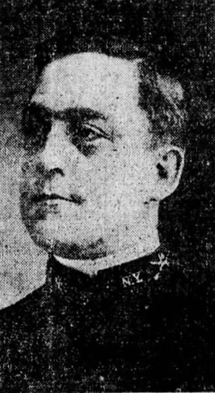 Portrait-style photograph of Arthur Wenige, shown facing the camera in formal attire.