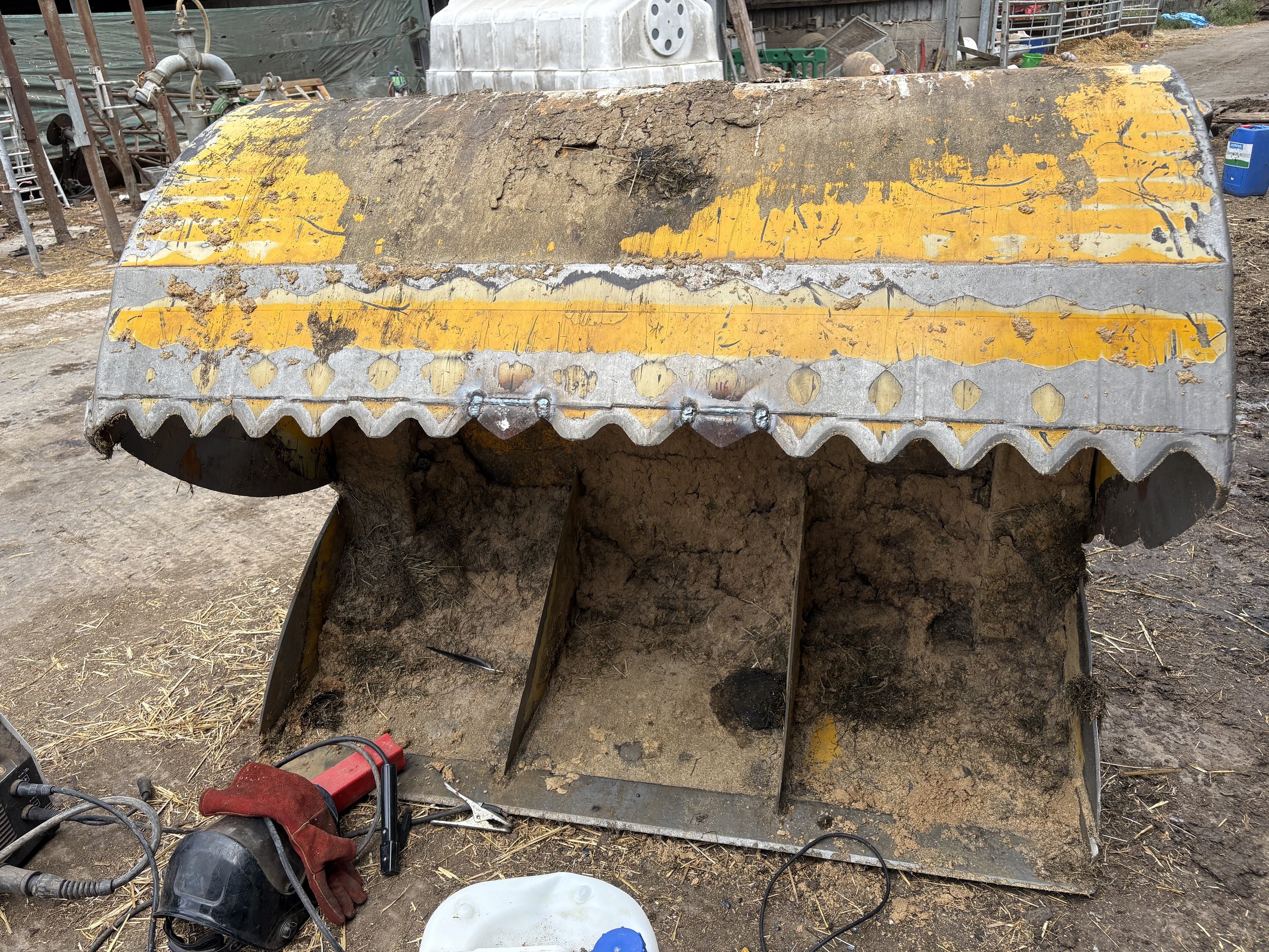 Two replacement teeth fitted to silage sheer grab.