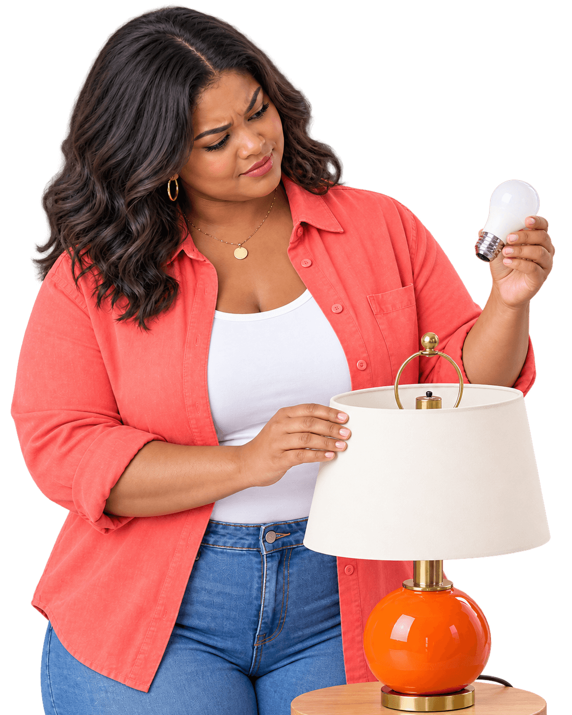 Homeowner inspecting a light bulb while troubleshooting a light that is not working
