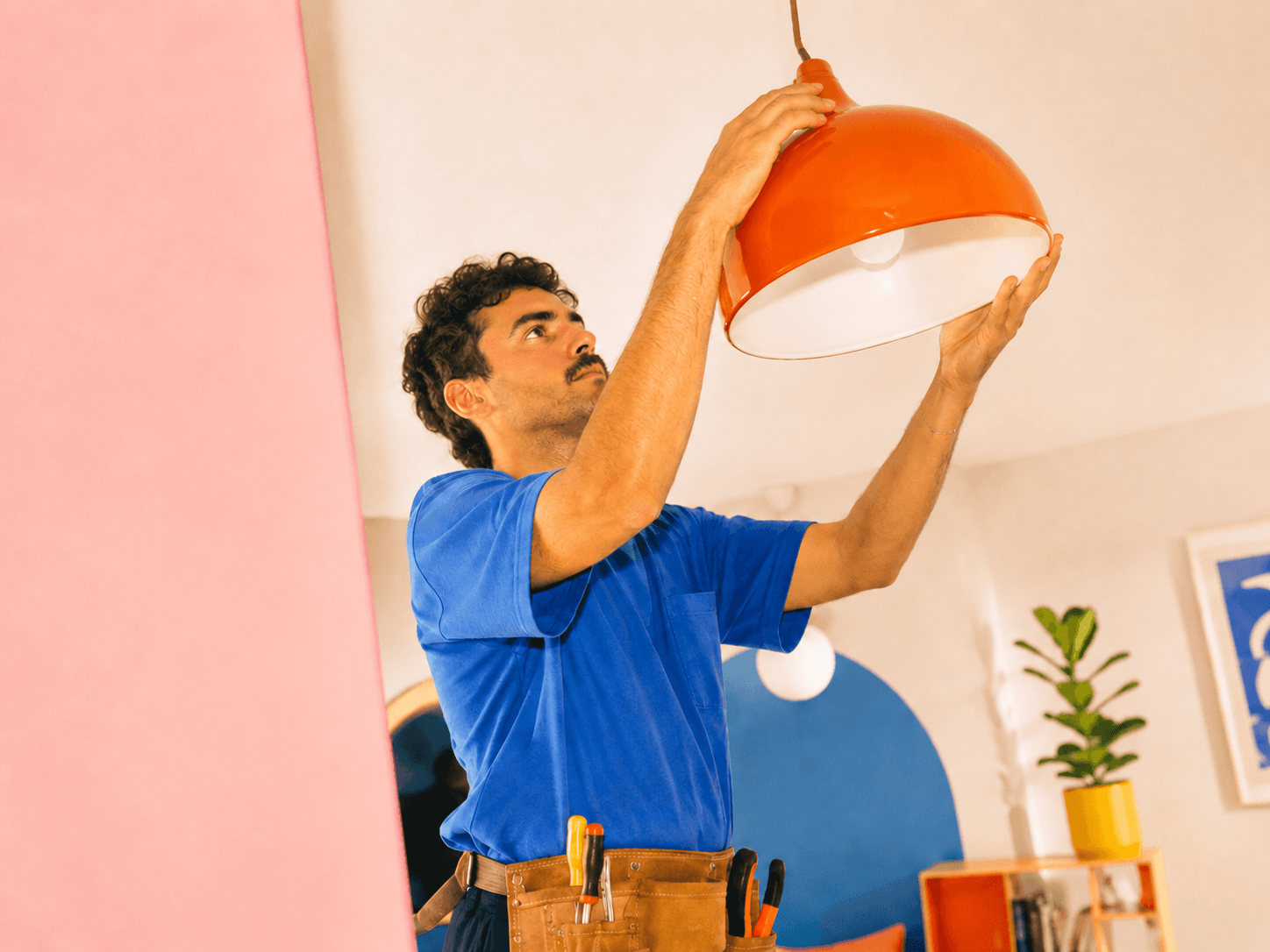 Right Now Electric electrician adjusting a pendant light in a Mount Dora or Minneola home.