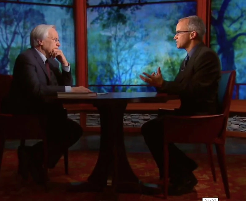 Ian Haney López sitting at a round table speaking during an interview