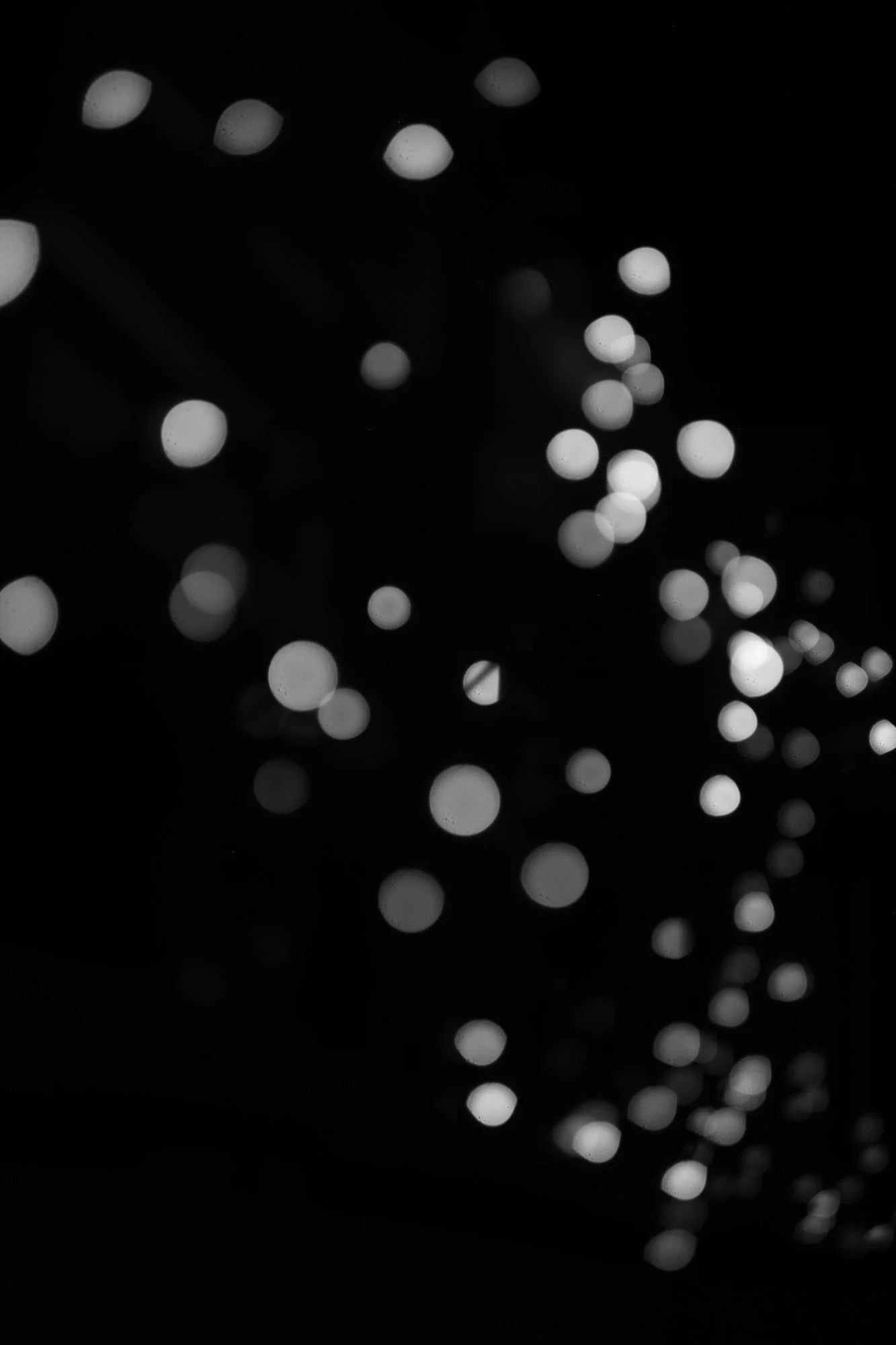 Black and white blurred bokeh lights