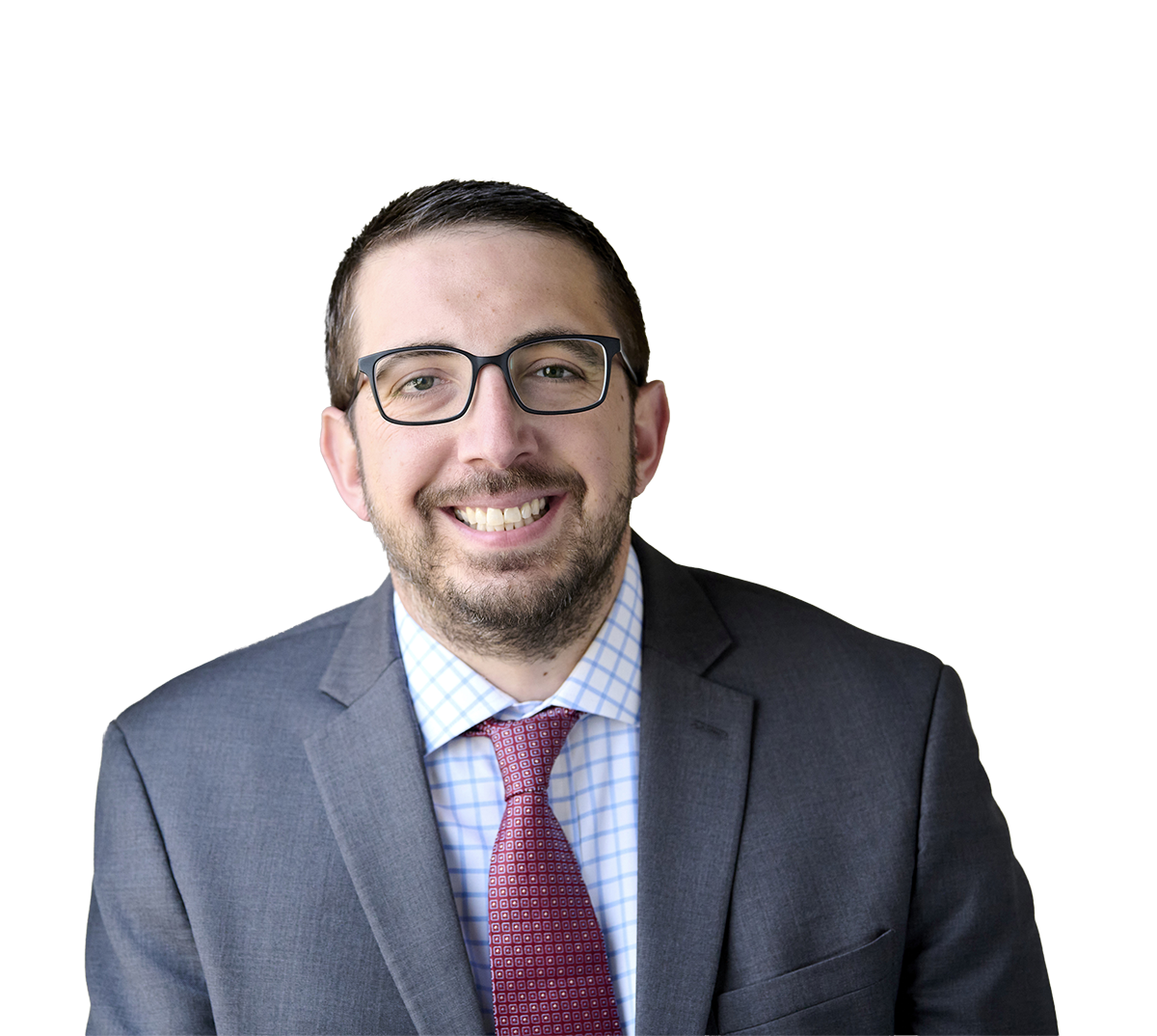 Smiling man in a business suit with glasses and a red tie, against a professional background.