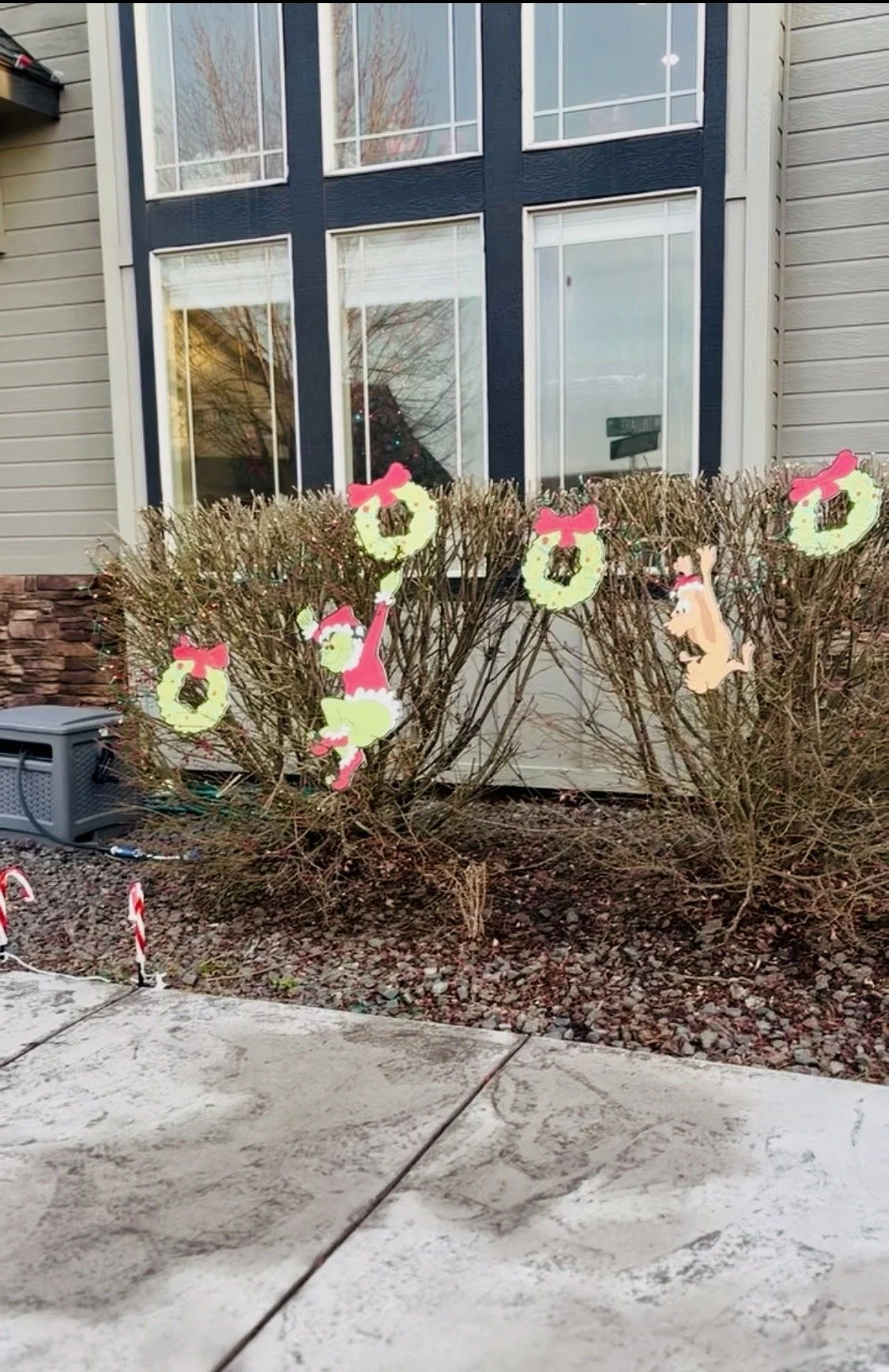 Jolly Holiday Exterior Coordinates- Meticulous landscape accents and character silhouettes tailored to extend your home's seasonal theme across the entire front lawn and walkway borders. 