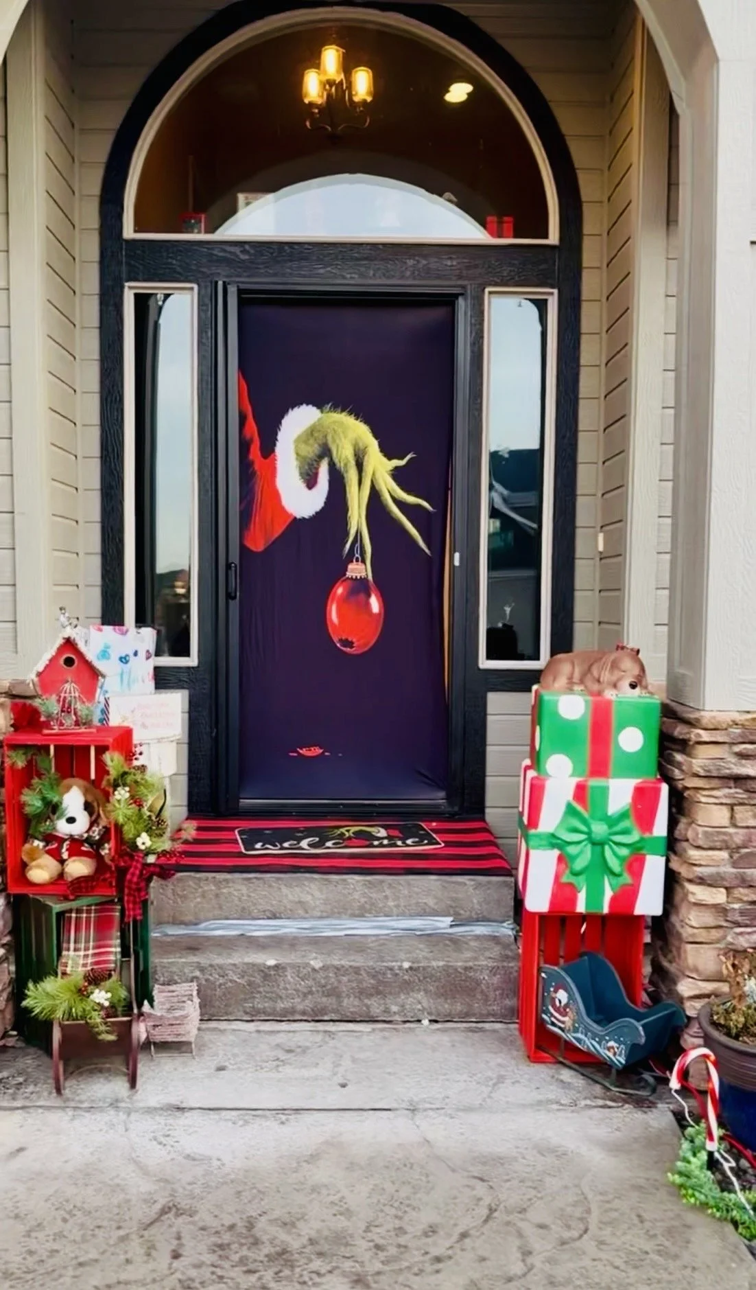Whimsical Seasonal Storytelling- Bringing timeless holiday character magic straight t Cherry Tree Lane. A vibrant custom-engineered entrance designed to stop traffic and delight the neighborhood with Grinch and all of his belongings! 