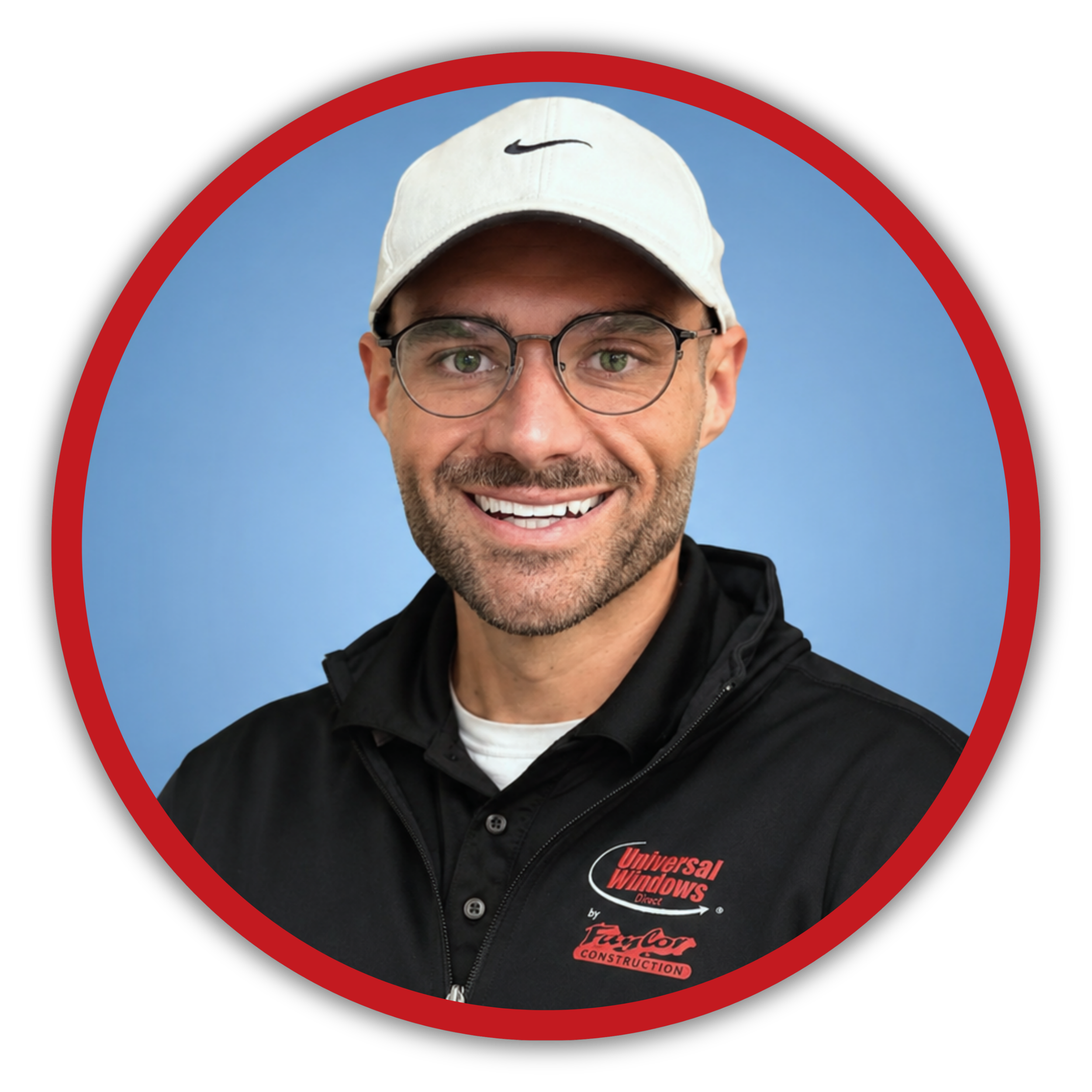 Close-up of a smiling man wearing glasses, a white Nike cap, and a black sweatshirt with 'Universal Windows' logo, standing outdoors with a clear blue sky background.