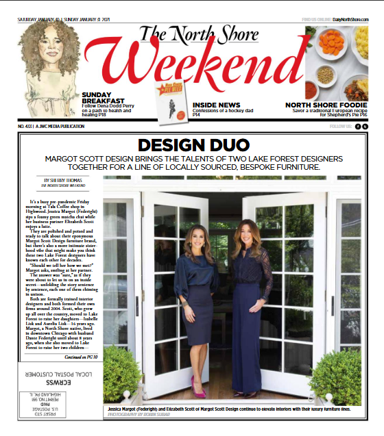 Front page of The North Shore Weekend newspaper featuring an article about Margot Scott Design, with a photo of two women, Jessica Margot and Elizabeth Scott, standing inside a glass door of a house with greenery outside.
