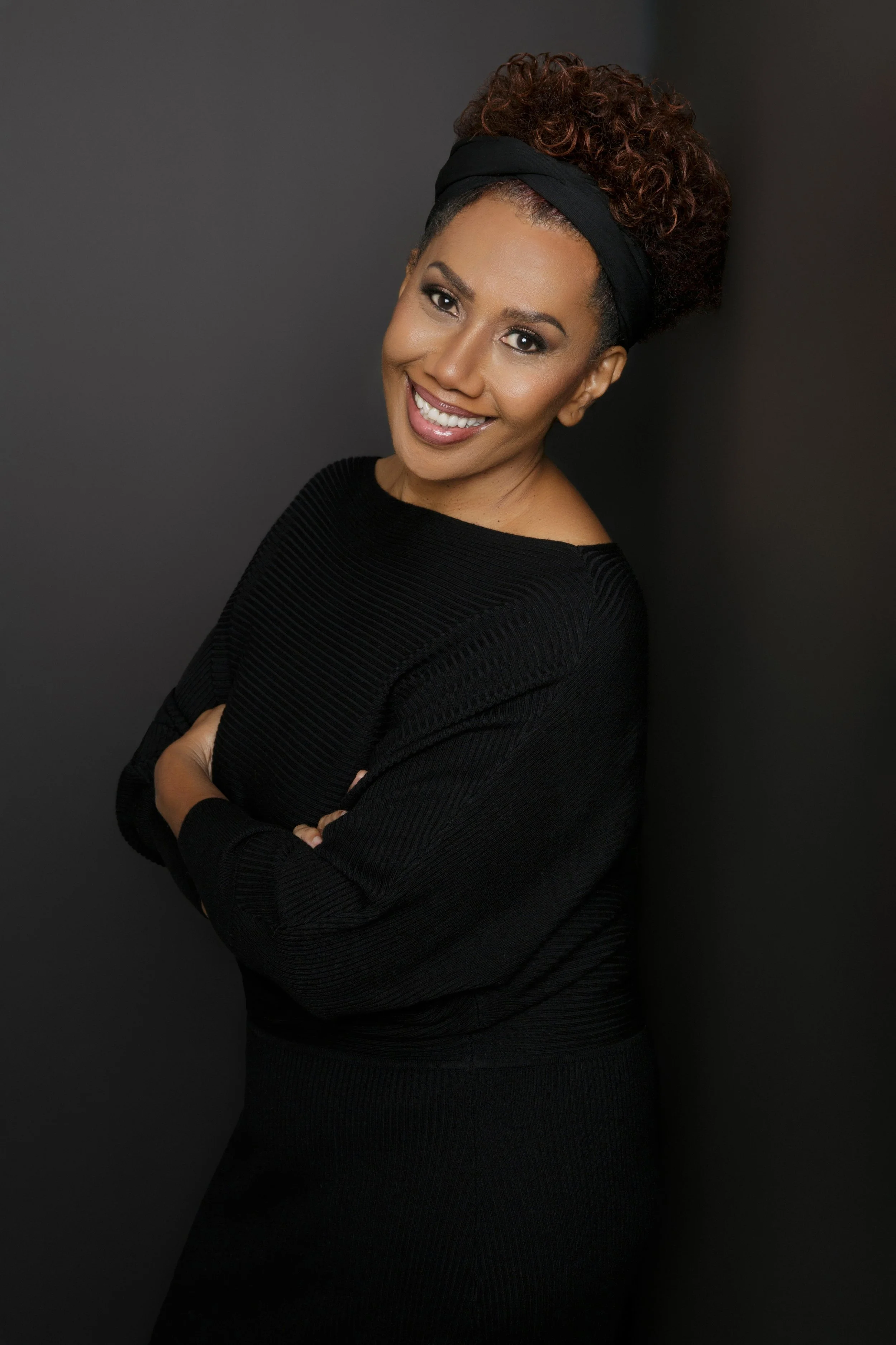 black woman black shirt smiling Kris G.jpg