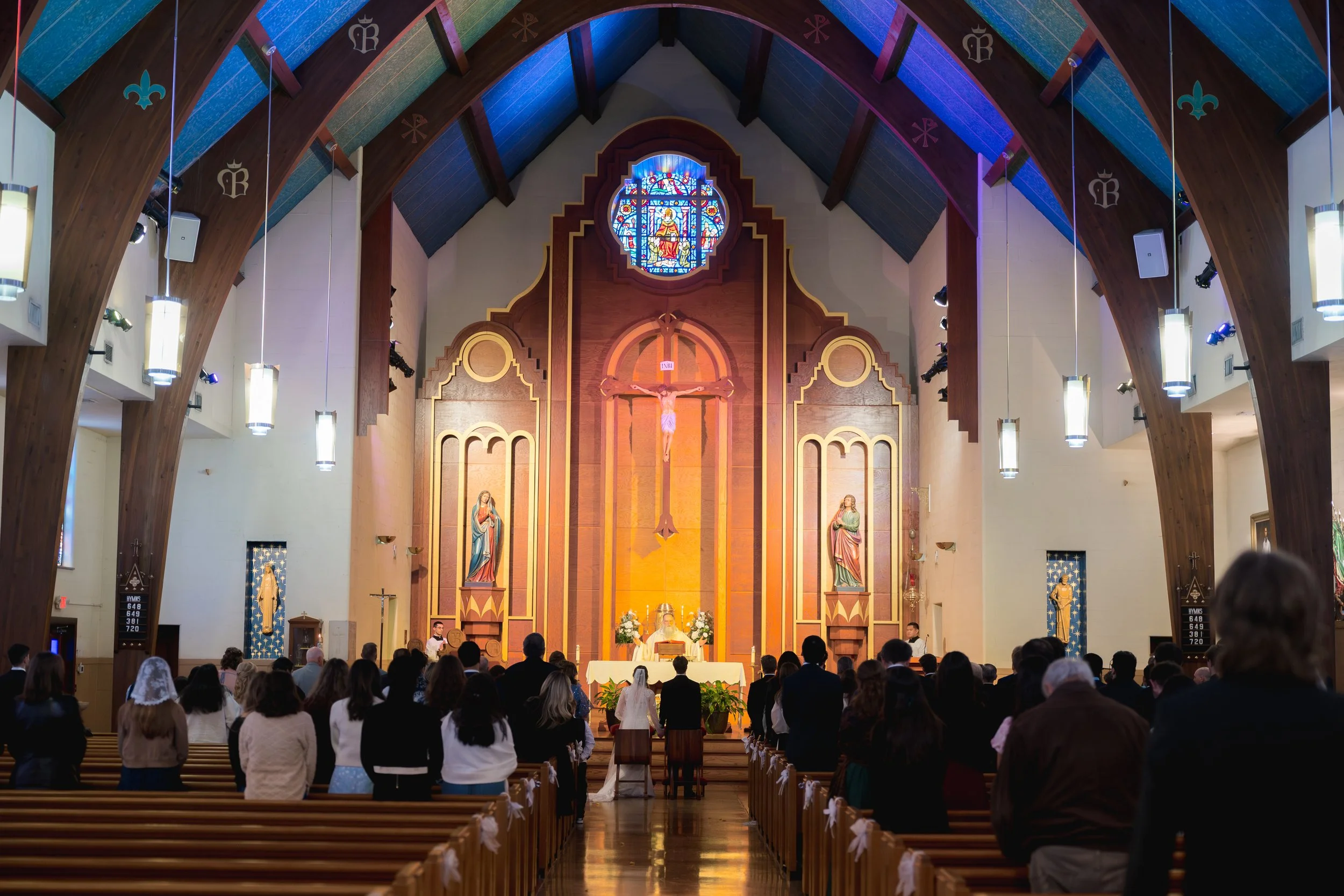 Catholic Wedding captured at St. Augustine Catholic Church by University of Florida in Gainesville, Florida by Florida Documentary Photographer Catherine Skelly