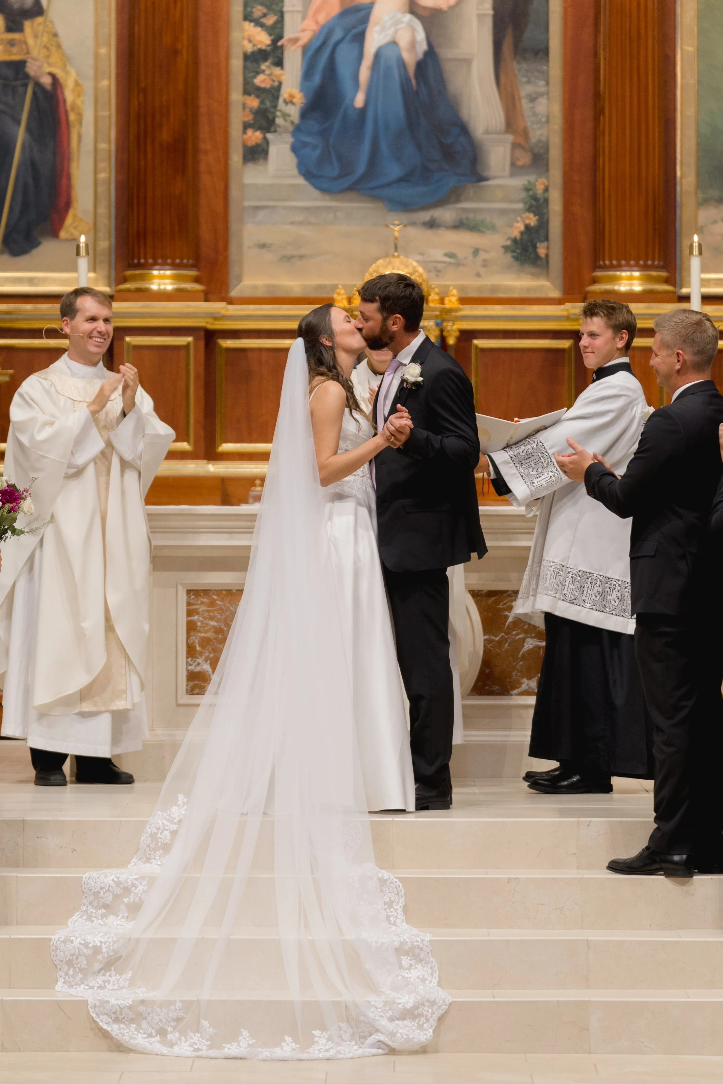 Catholic Wedding Ceremony at Co-Cathedral St. Thomas Moore in Tallahassee, Florida captured by Florida Documentary Photographer Catherine Skelly