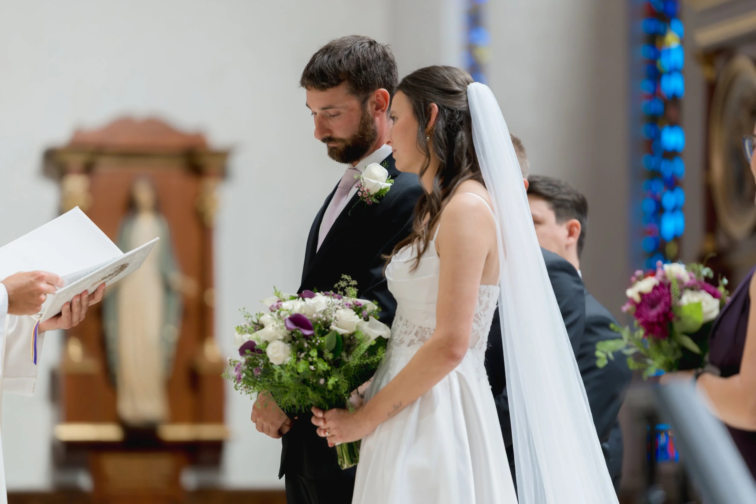 Catholic Wedding Ceremony at Co-Cathedral St. Thomas Moore in Tallahassee, Florida captured by Florida Documentary Photographer Catherine Skelly