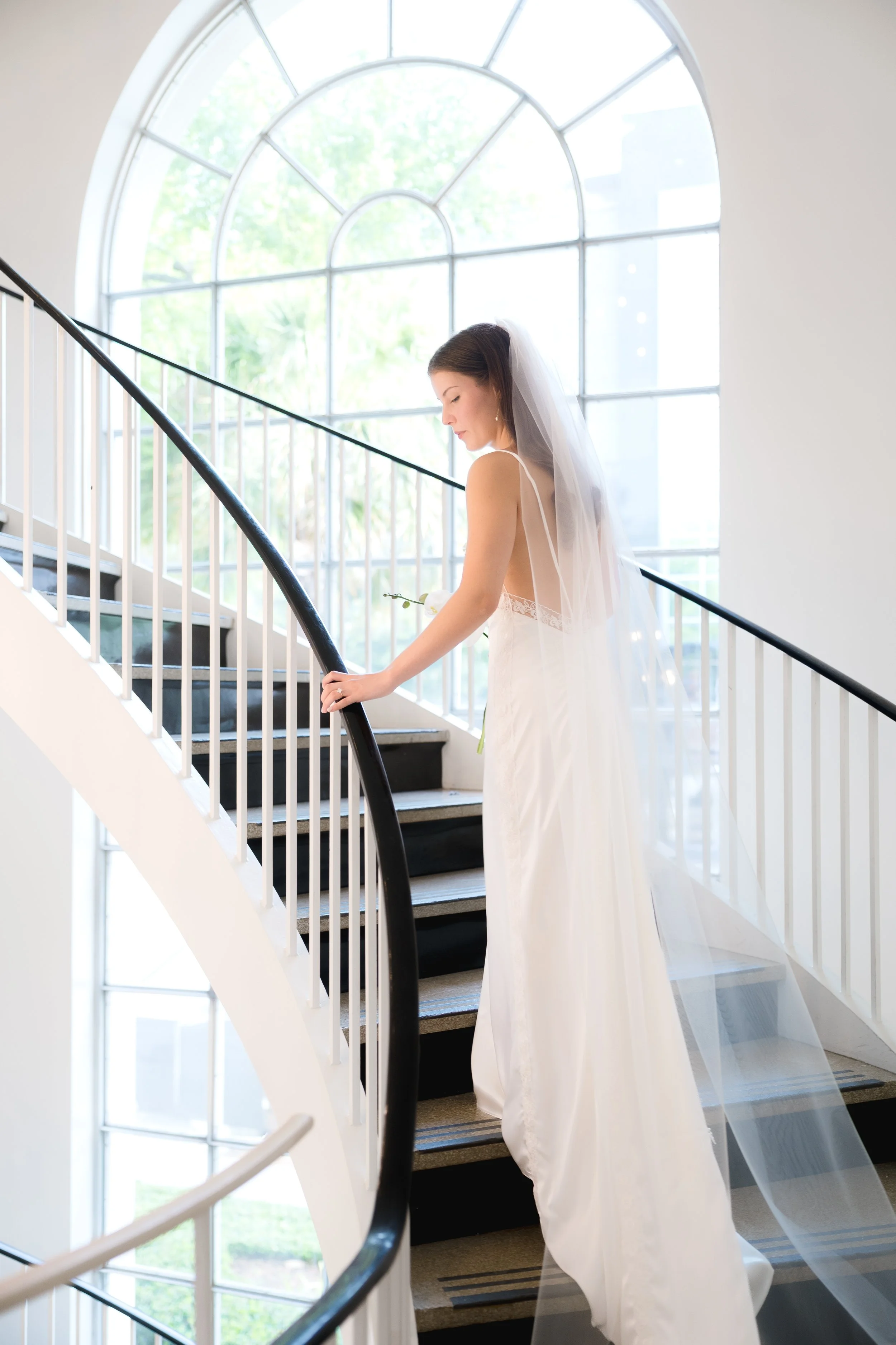 Bridal Portraits on the stairs at First Presbyterian Church in Orlando captured by Florida Documentary Photographer Catherine Skelly