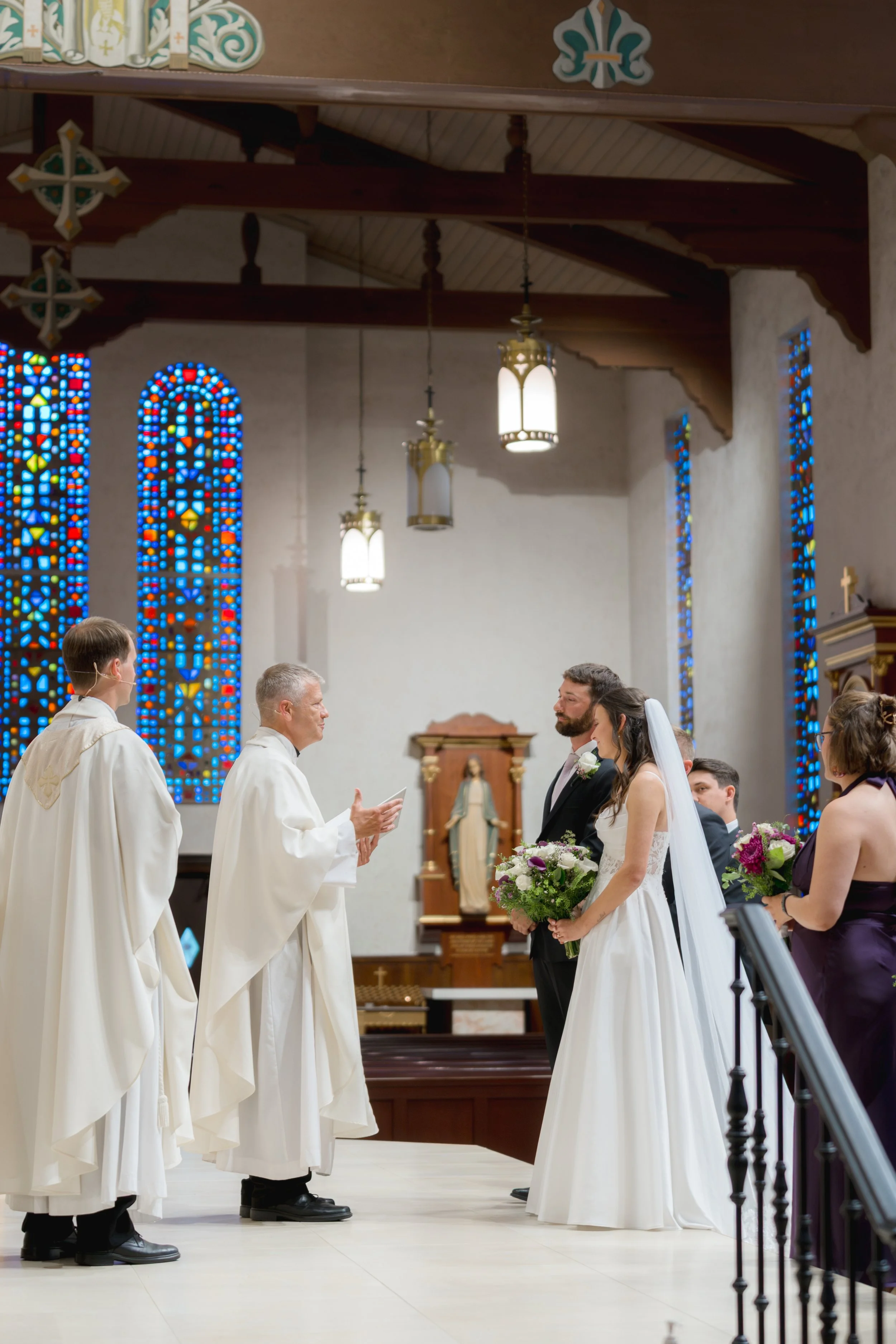Catholic Wedding Ceremony at Co-Cathedral St. Thomas Moore in Tallahassee, Florida captured by Florida Documentary Photographer Catherine Skelly