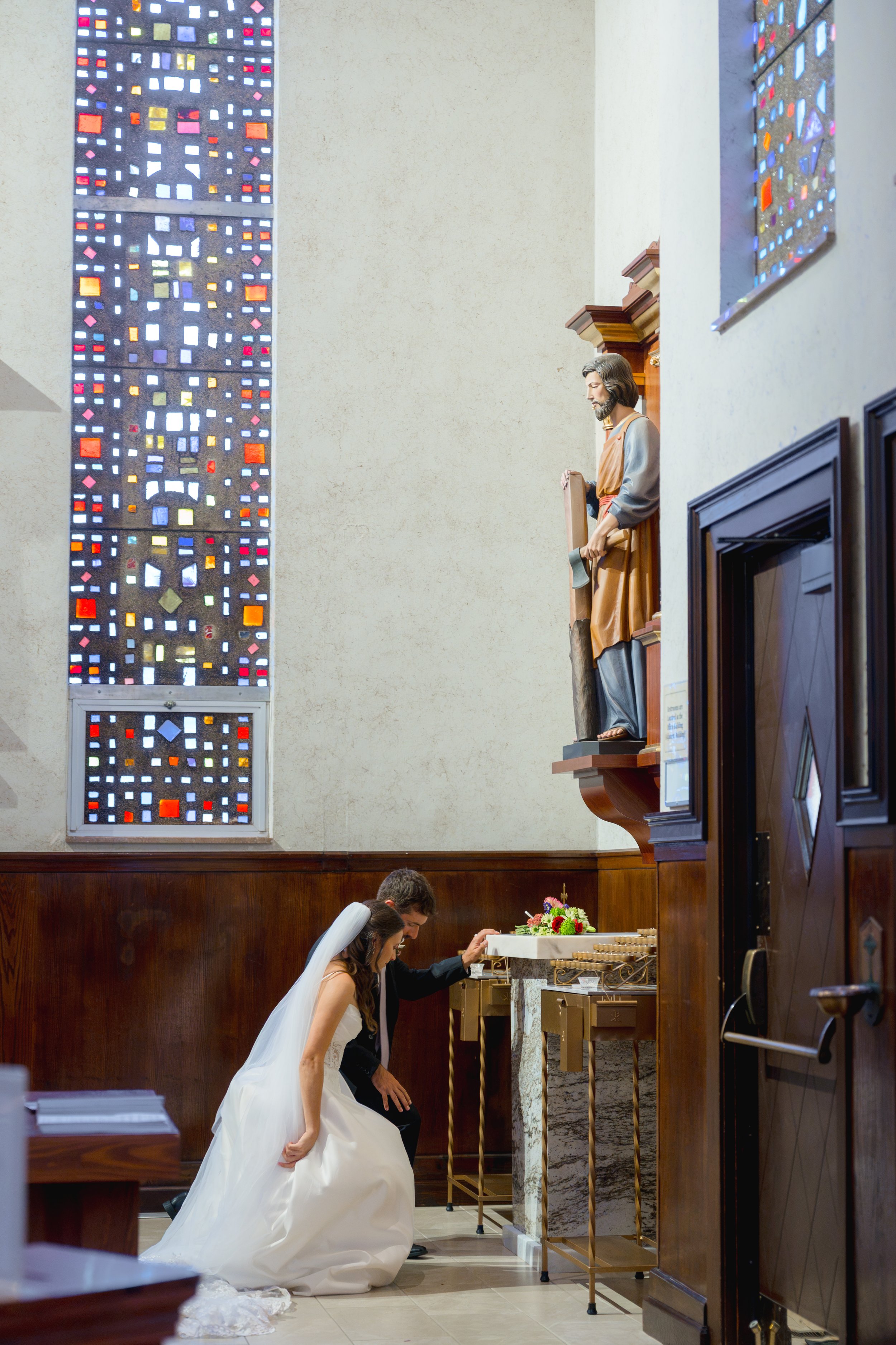 Catholic Wedding Ceremony at Co-Cathedral St. Thomas Moore in Tallahassee, Florida captured by Florida Documentary Photographer Catherine Skelly