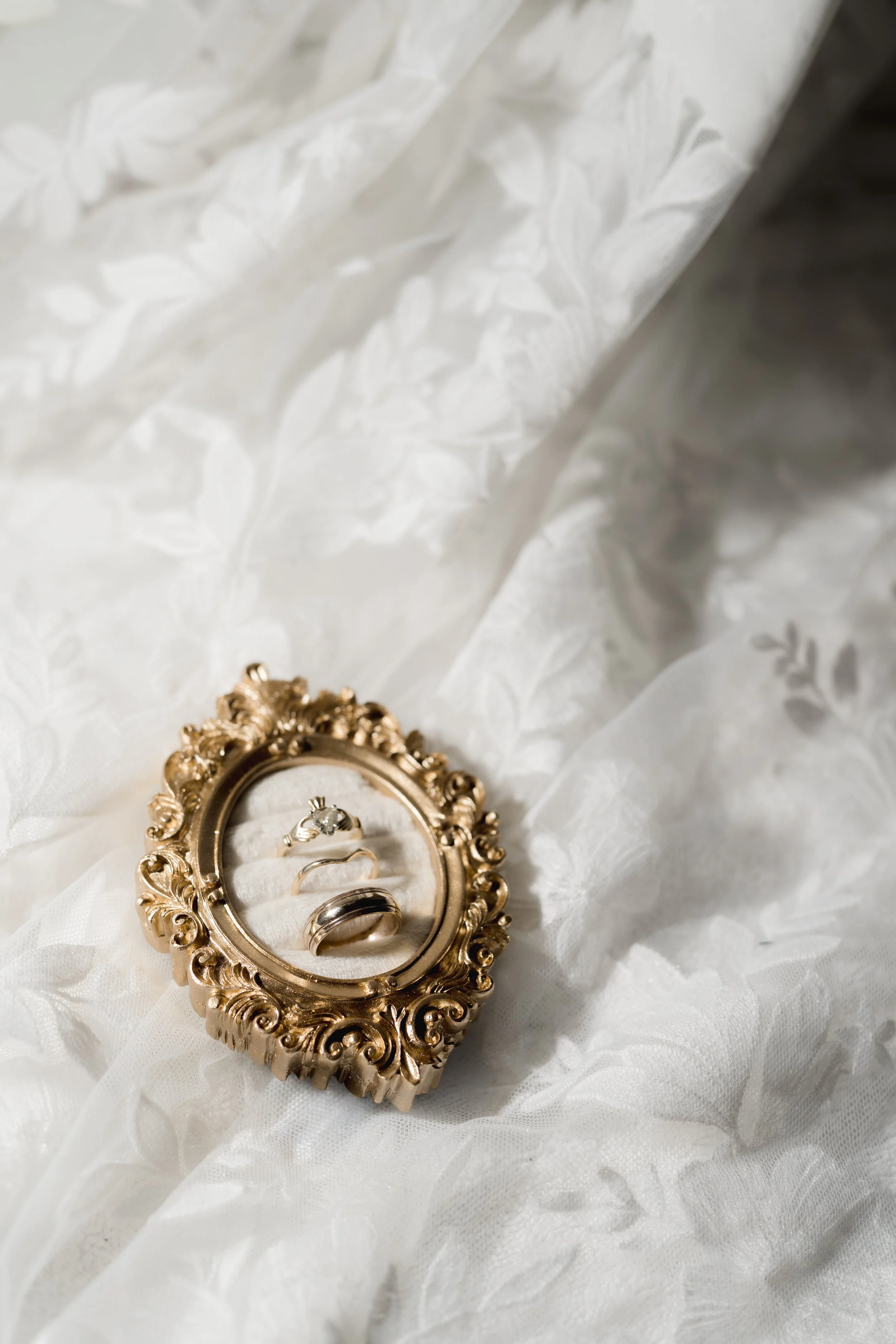 Catholic-inspired details for a Catholic Wedding captured at The Best Western Grand in Gainesville, Florida by Florida Documentary Photographer Catherine Skelly