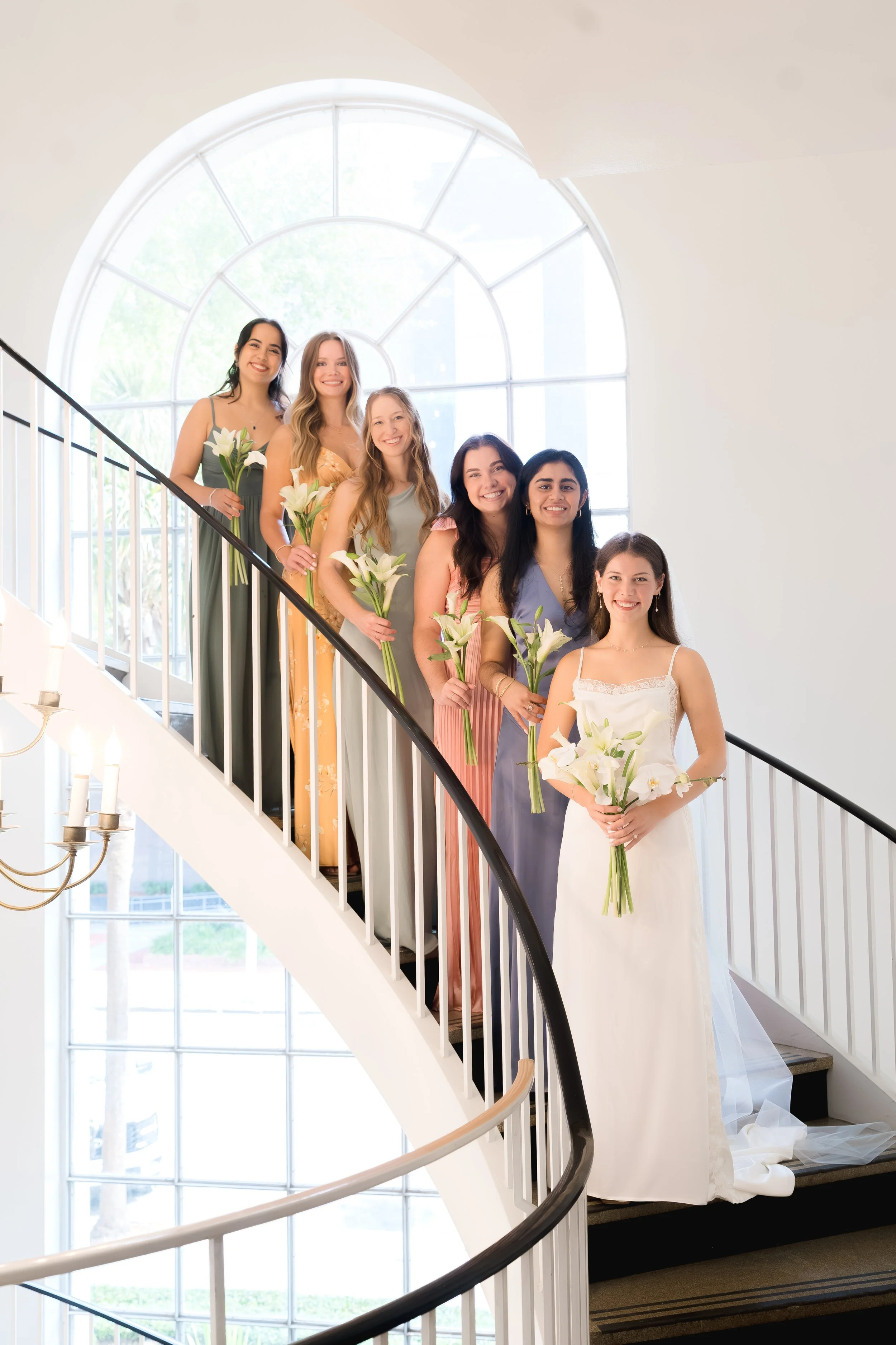 Bridesmaids Photos on the stairs at First Presbyterian Church in Orlando captured by Florida Documentary Photographer Catherine Skelly
