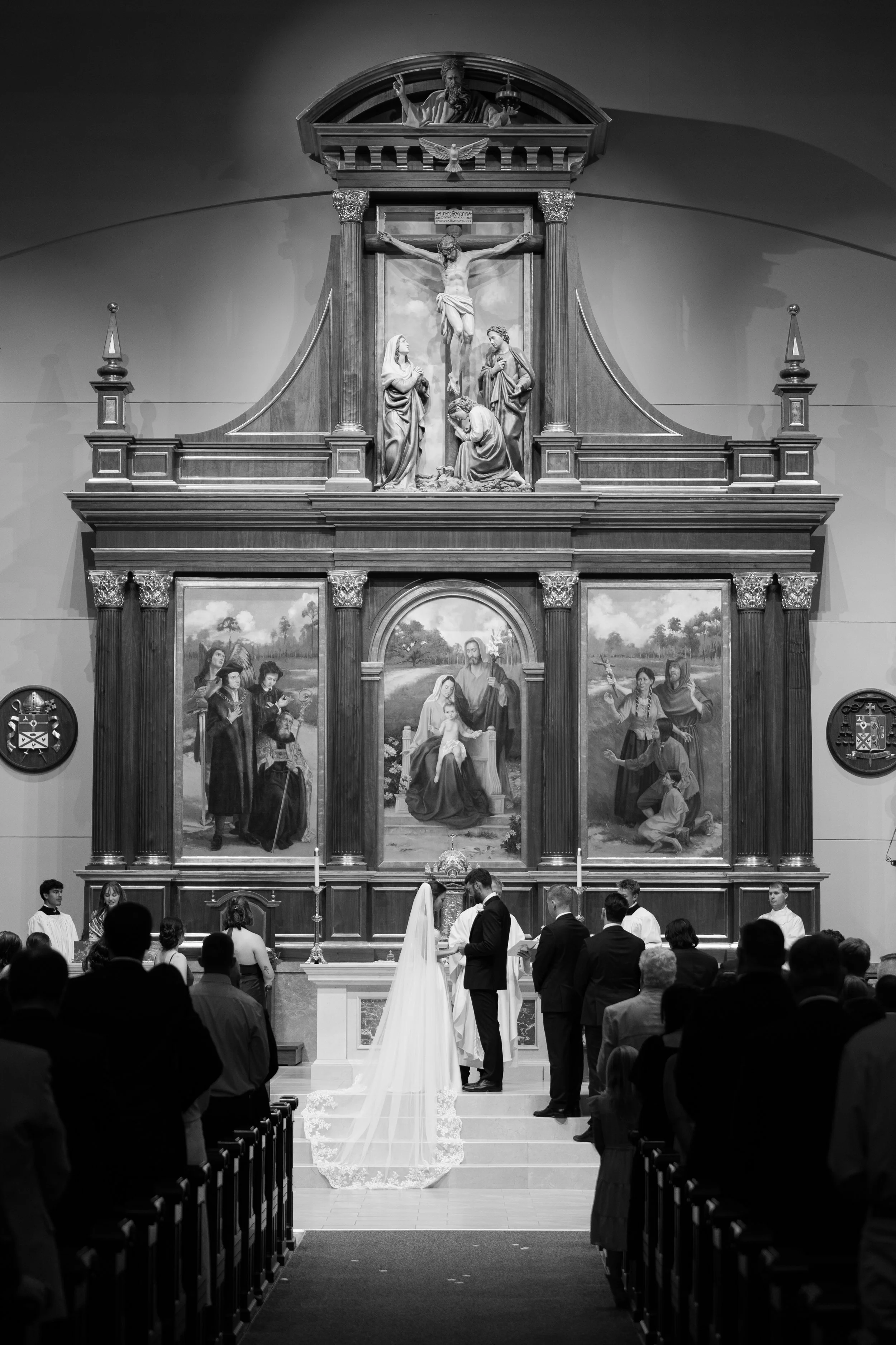Catholic Wedding Ceremony at Co-Cathedral St. Thomas Moore in Tallahassee, Florida captured by Florida Documentary Photographer Catherine Skelly