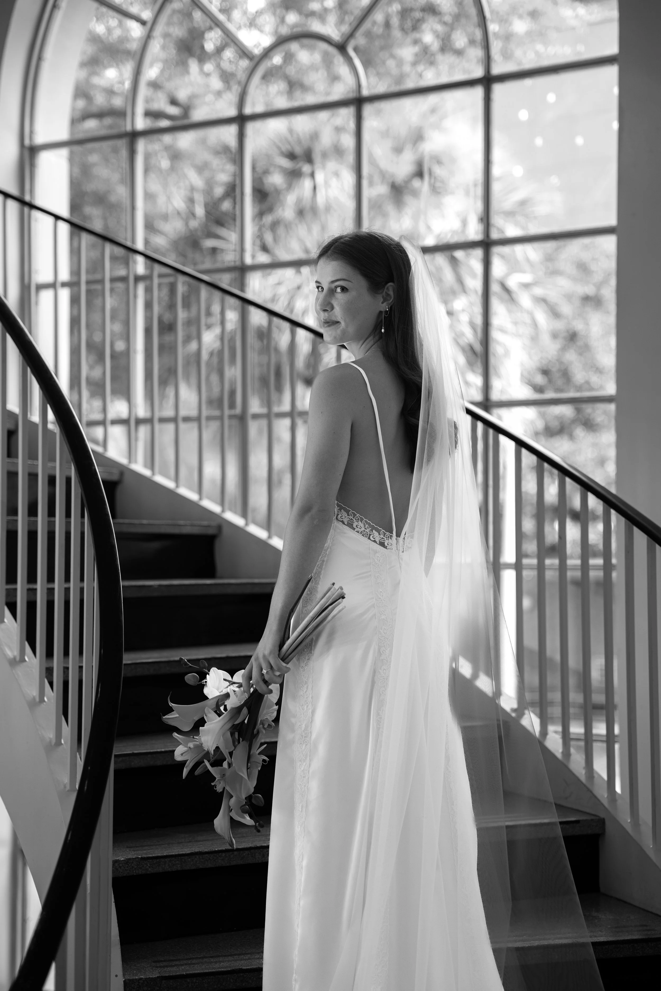 Bridal Portraits on the stairs at First Presbyterian Church in Orlando captured by Florida Documentary Photographer Catherine Skelly