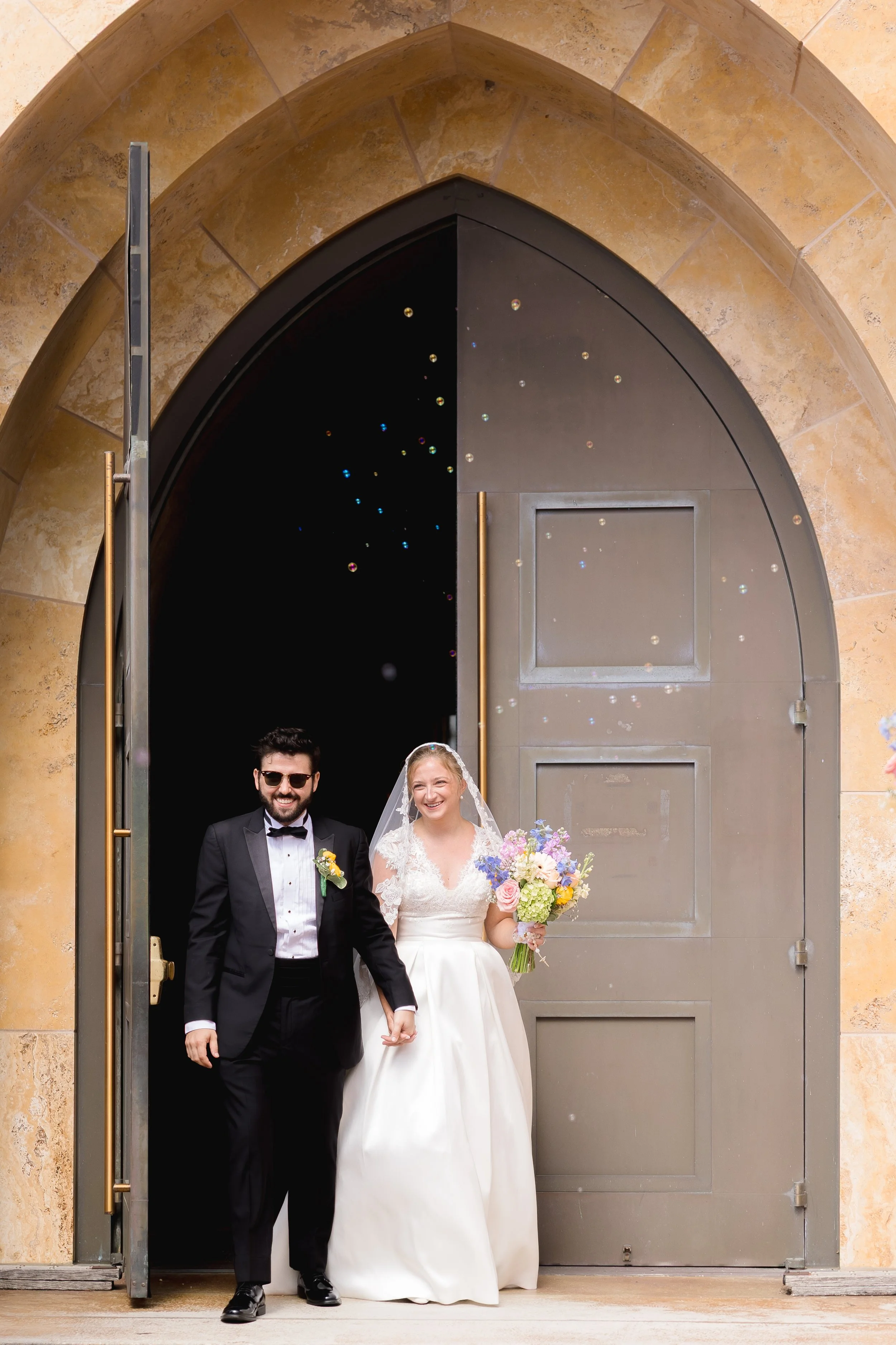 Catholic Wedding Exit at Ave Maria Catholic Church in Ave Maria, Florida by Florida Documentary Wedding Photographer Catherine Skelly
