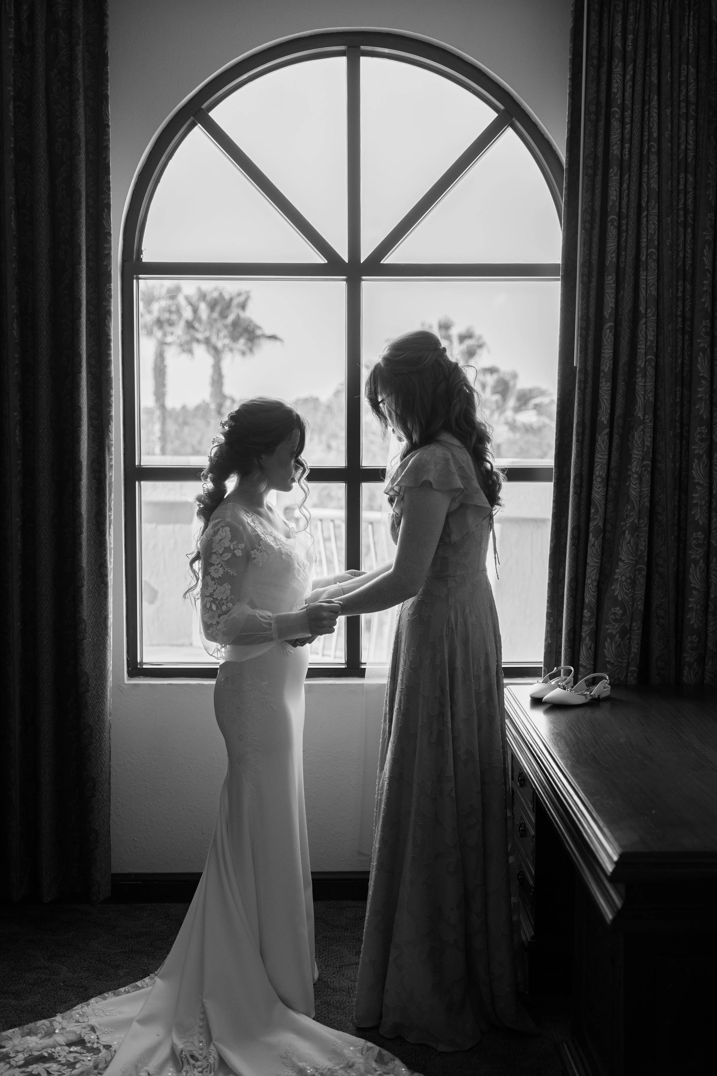 Candid Getting Ready Photos for a Catholic Wedding captured at The Best Western Grand in Gainesville, Florida by Florida Documentary Photographer Catherine Skelly