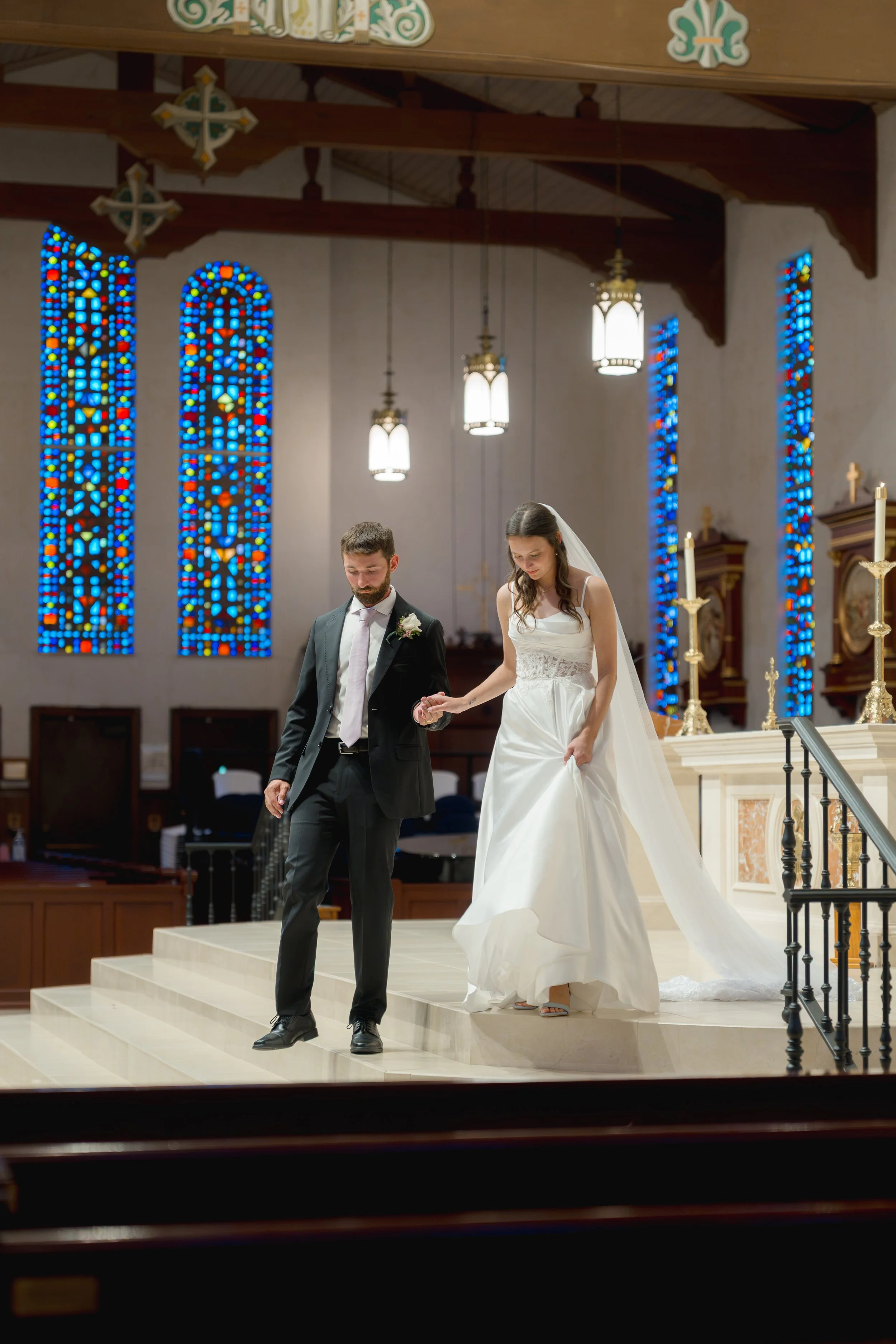 Catholic Wedding Ceremony at Co-Cathedral St. Thomas Moore in Tallahassee, Florida captured by Florida Documentary Photographer Catherine Skelly