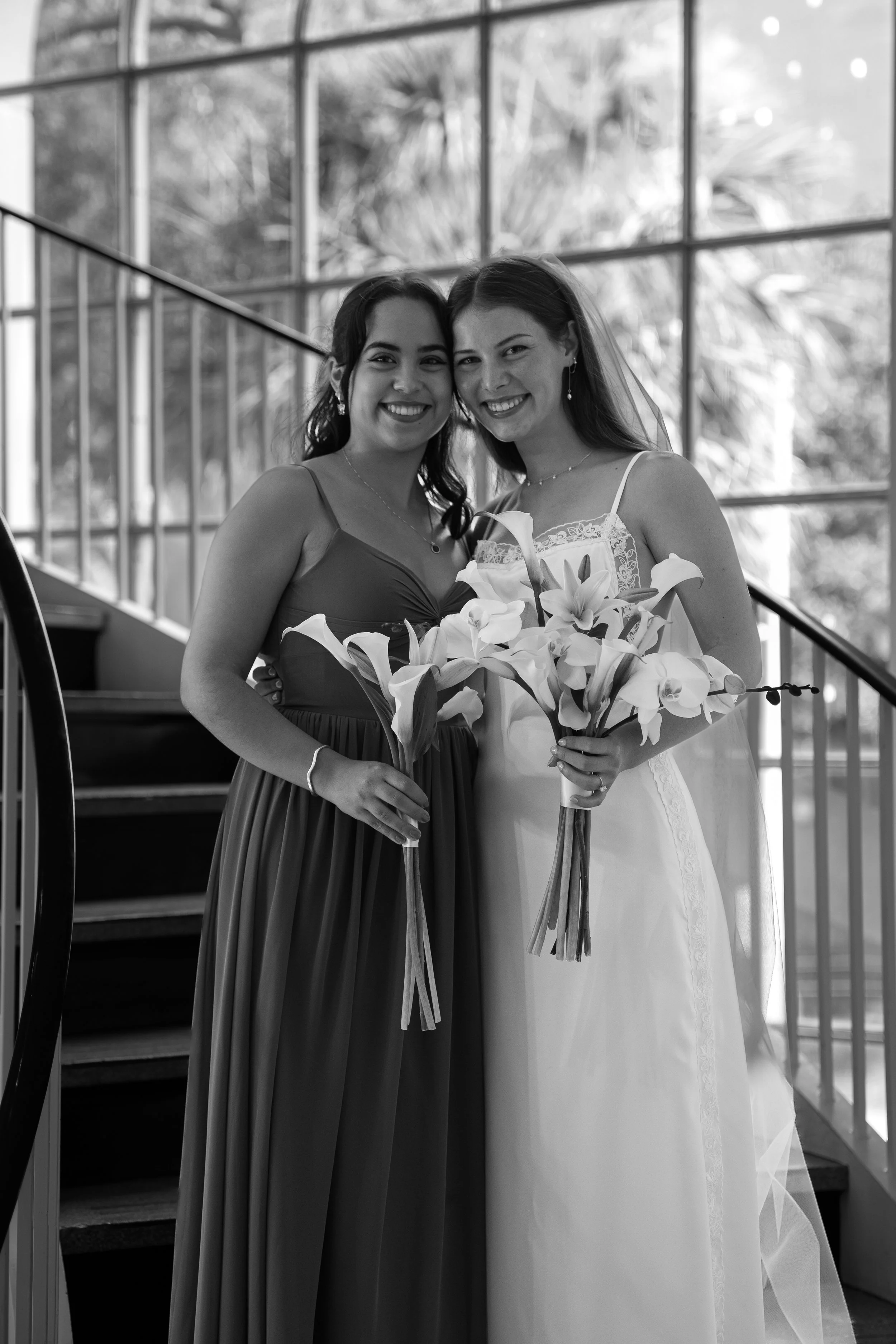 Bridesmaids Photos on the stairs at First Presbyterian Church in Orlando captured by Florida Documentary Photographer Catherine Skelly