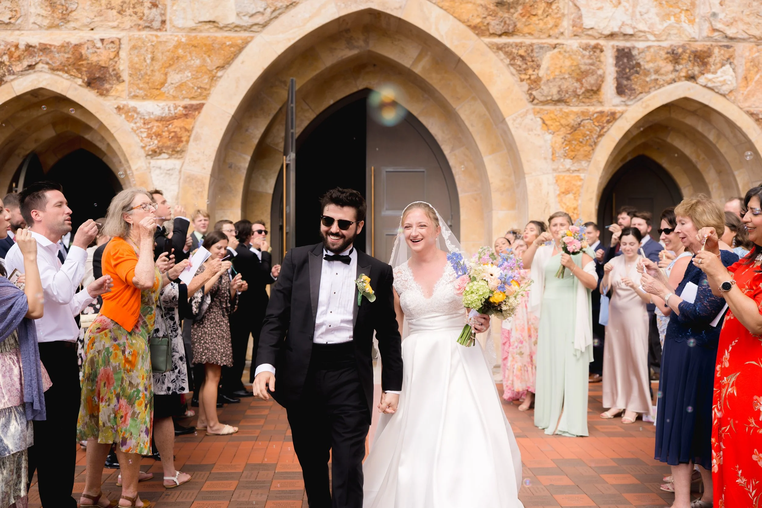 Catholic Wedding Exit at Ave Maria Catholic Church in Ave Maria, Florida by Florida Documentary Wedding Photographer Catherine Skelly