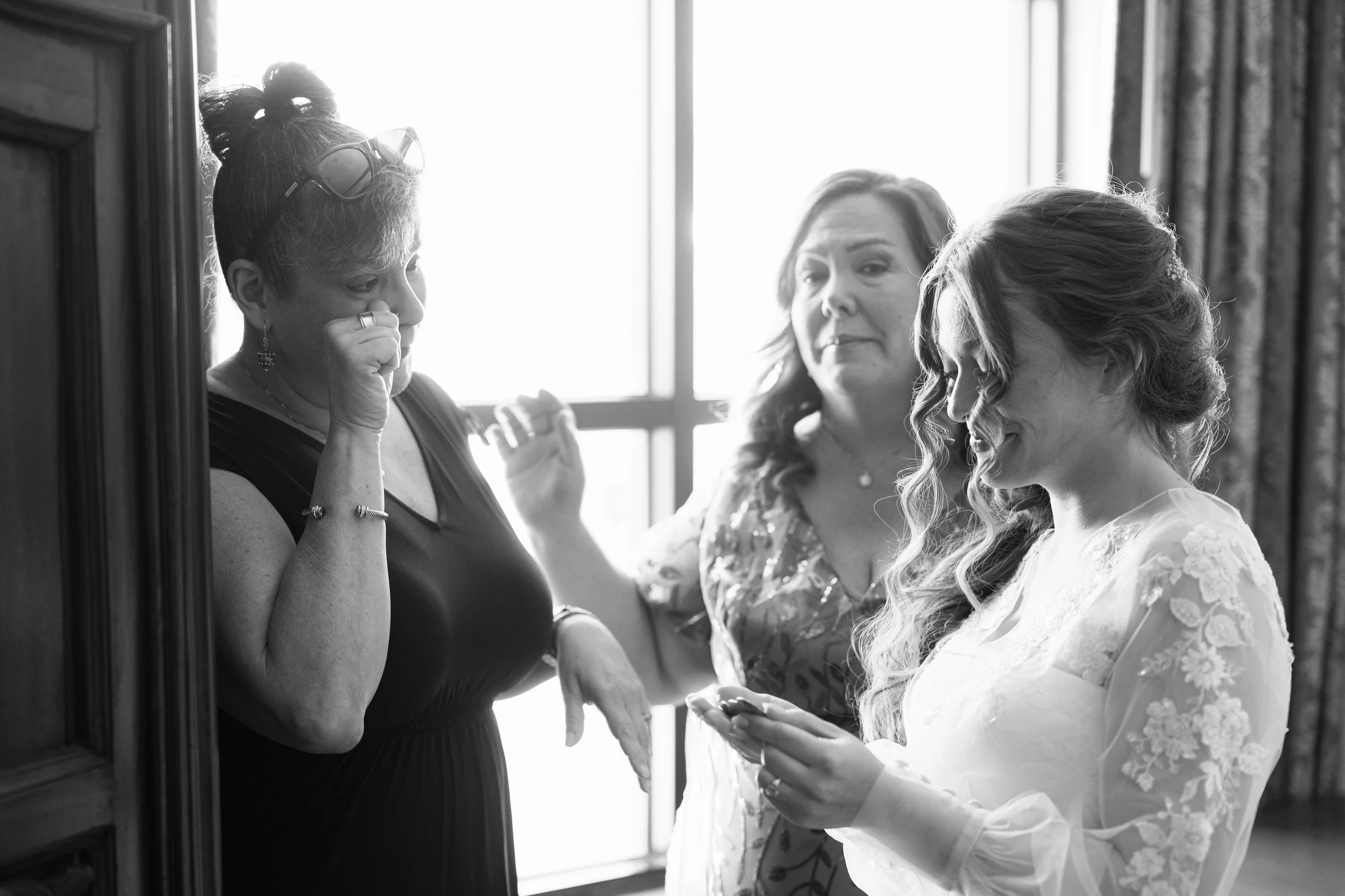 Candid Getting Ready Photos for a Catholic Wedding captured at The Best Western Grand in Gainesville, Florida by Florida Documentary Photographer Catherine Skelly