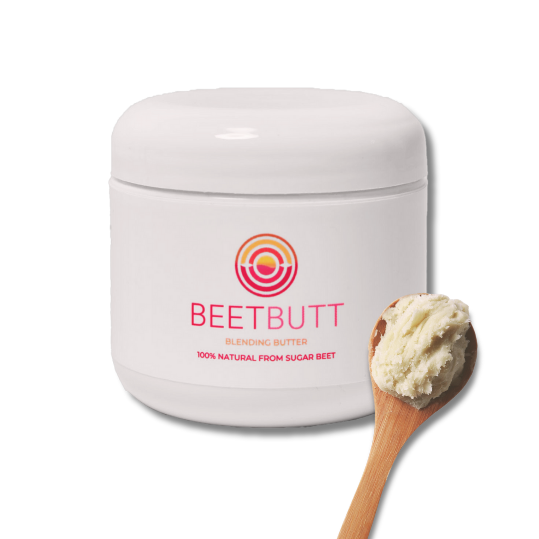 A white jar labeled 'Beetbutt Blending Butter' with a colorful circular logo, next to a wooden spoon with a scoop of creamy butter, all on a white background.