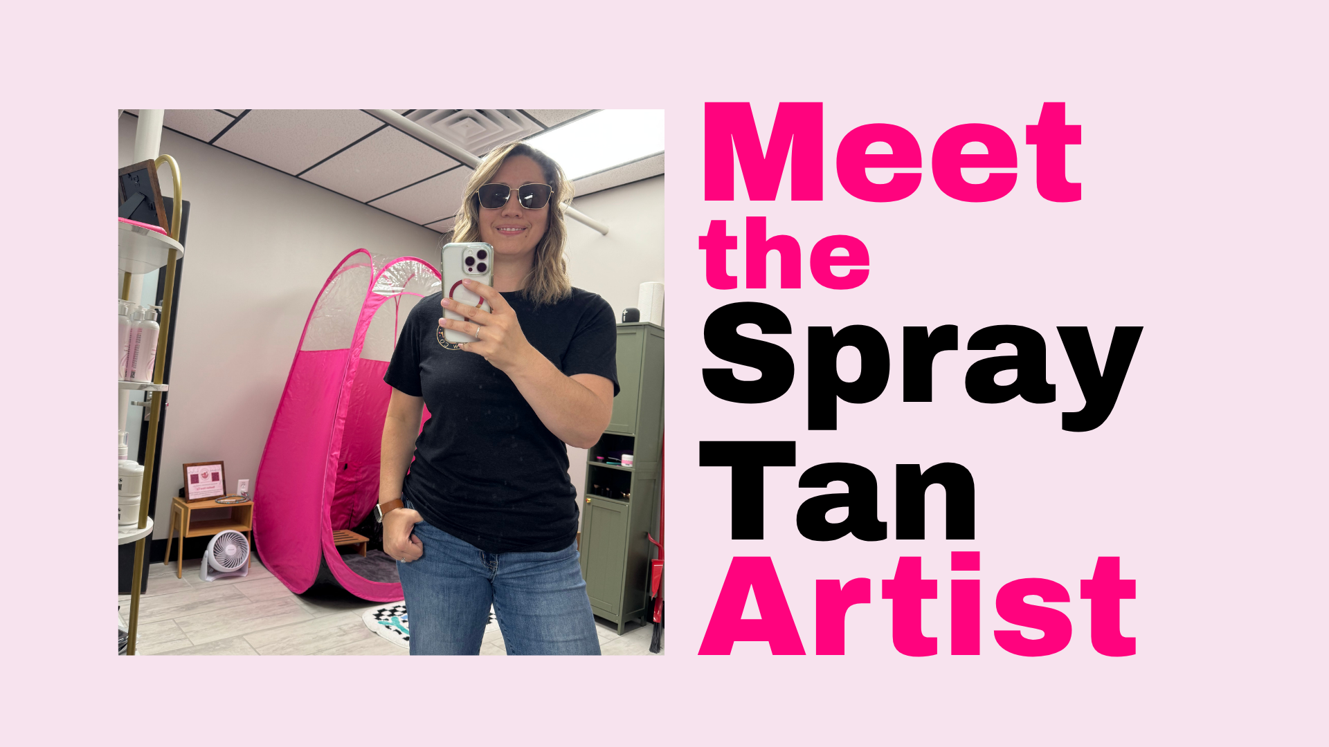 A woman with blonde hair, wearing sunglasses and a black t-shirt, taking a selfie in a room with pink and gray decor, including a pink tent and shelves.