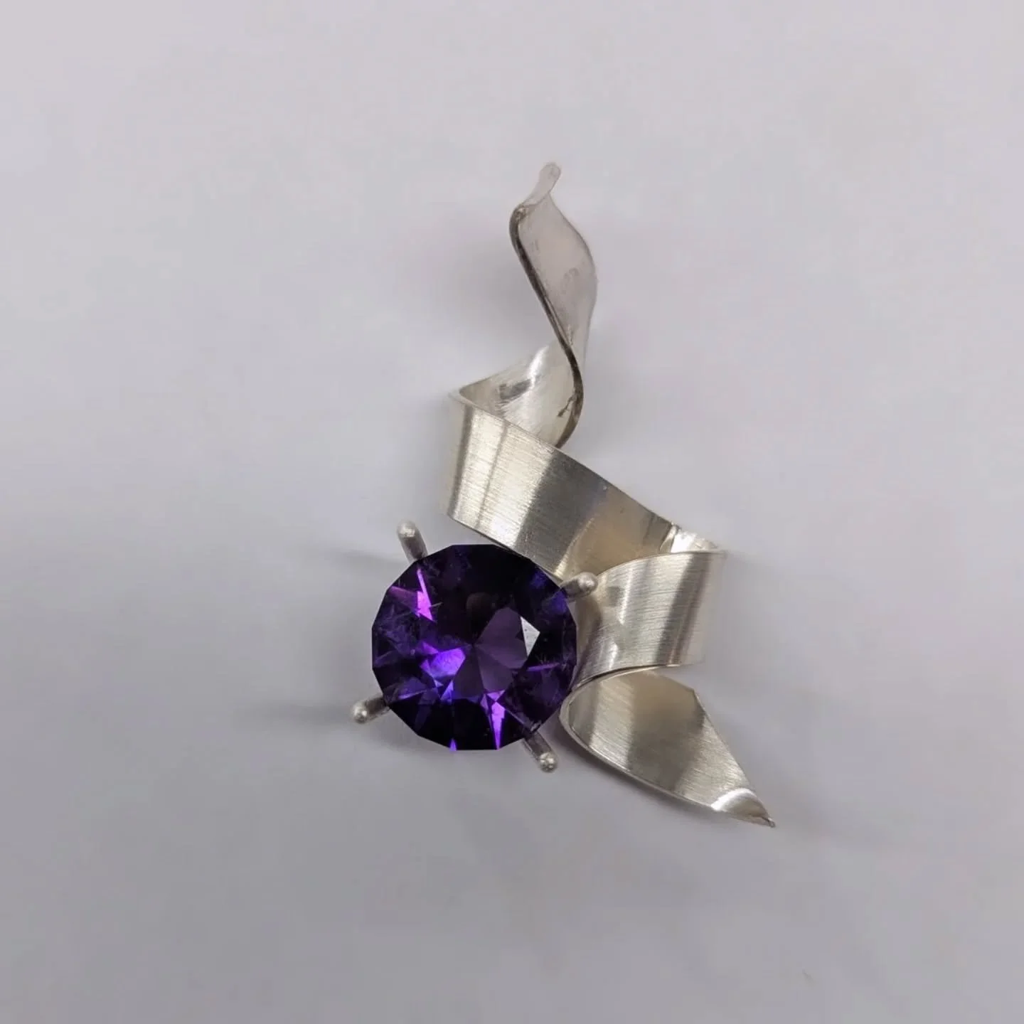 Work in progress... A lot of my pieces need their balance taken into consideration before and during the design, but that's part of the fun! This piece isn't fully soldered nor is it set, but bluetack is pretty important to make sure everything hangs