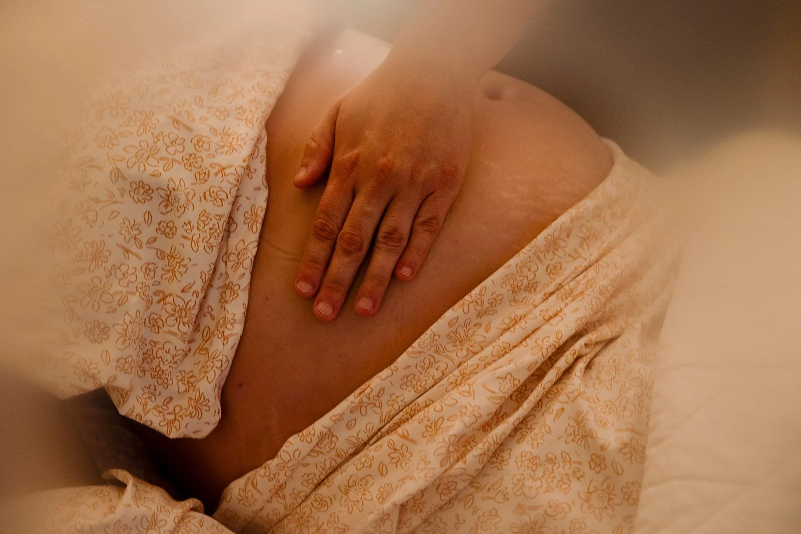 A mother receiving a prenatal massage.