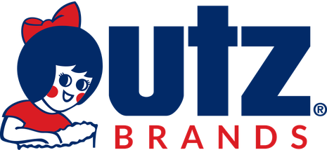 Logo of Jutz Brands featuring a cartoon girl with a bow in her hair, smiling and leaning on her hands.