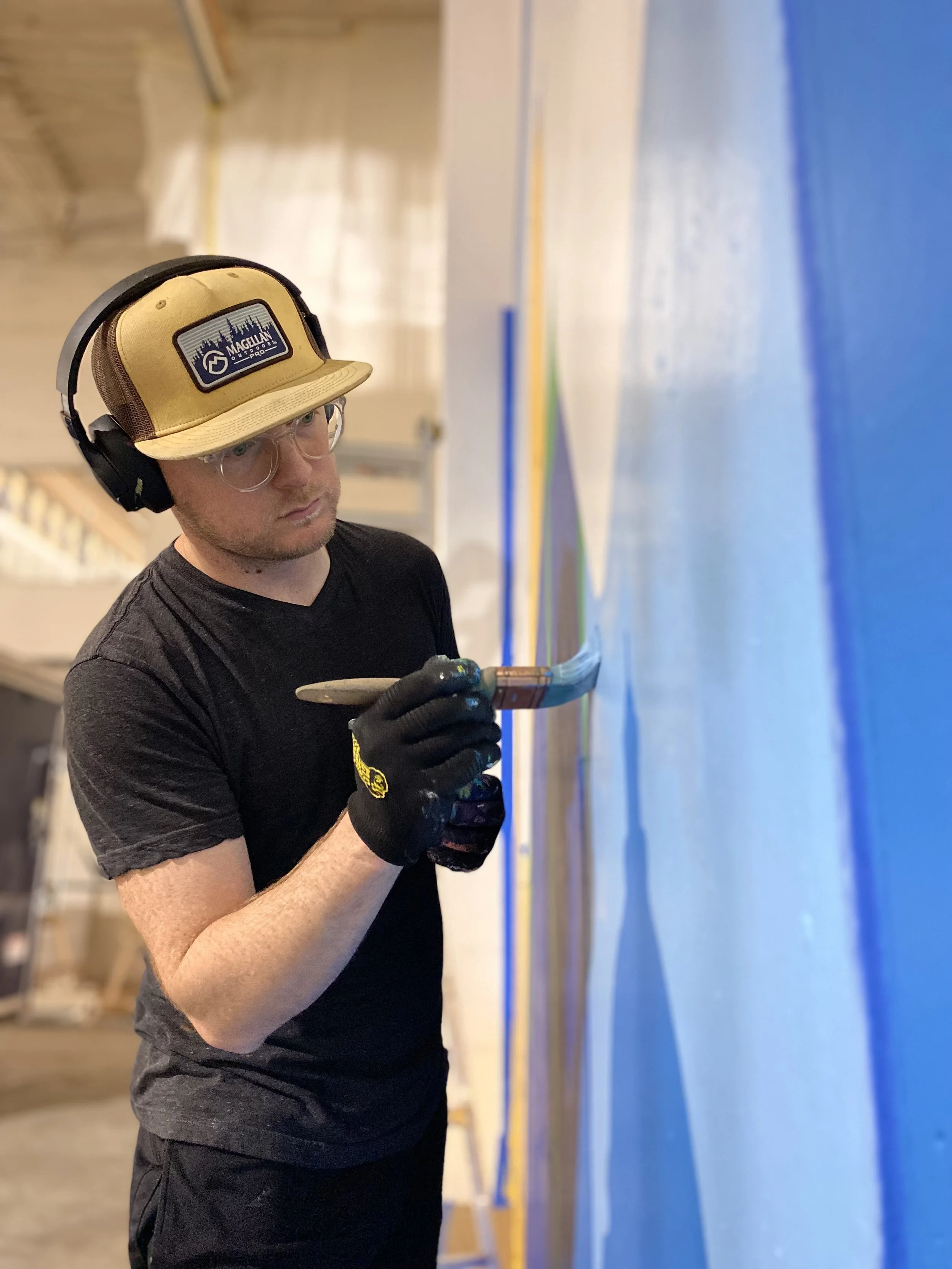 Joel Boyd painting Morin Corp Mural