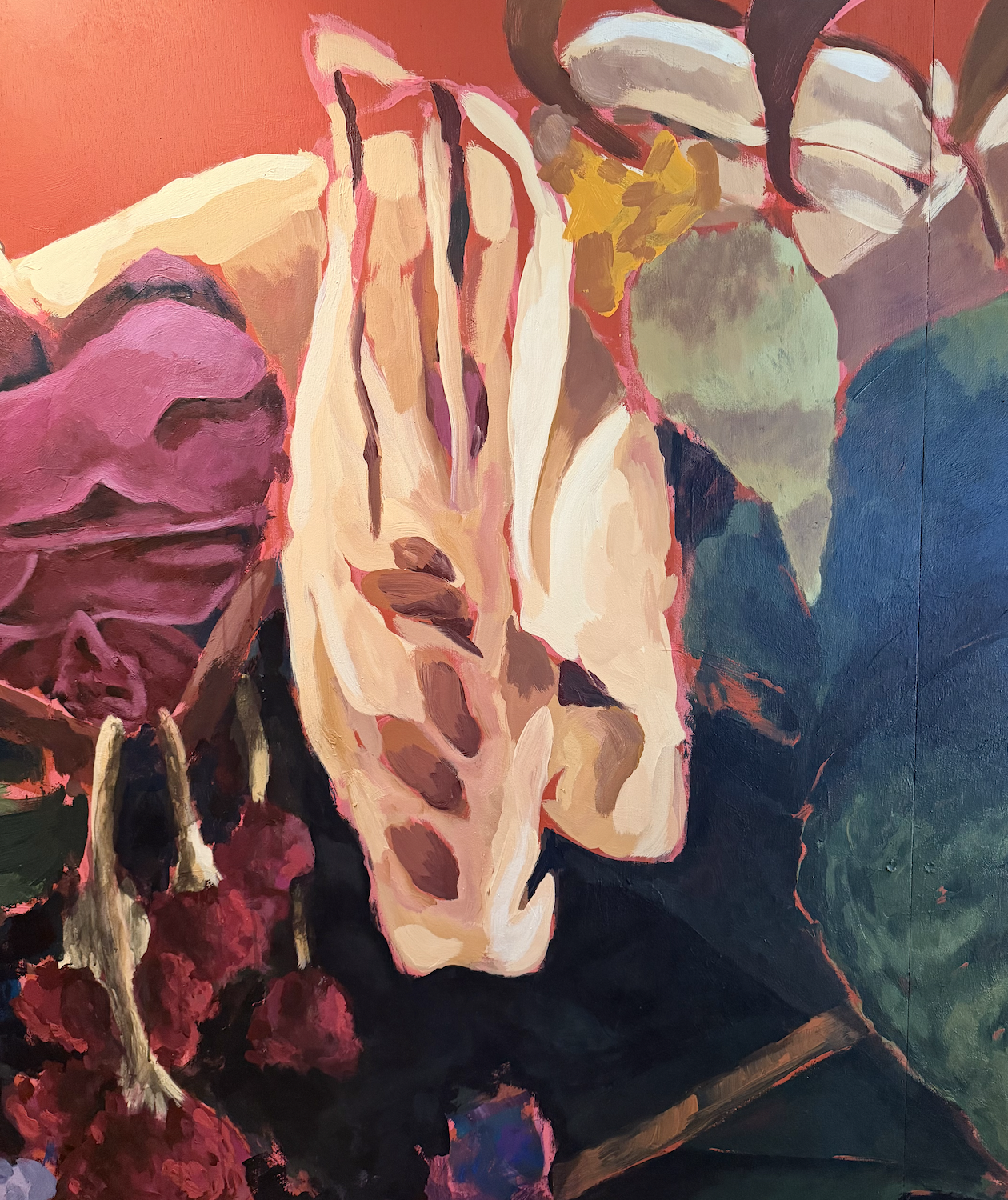 A colorful abstract mural of flowers and foliage.
